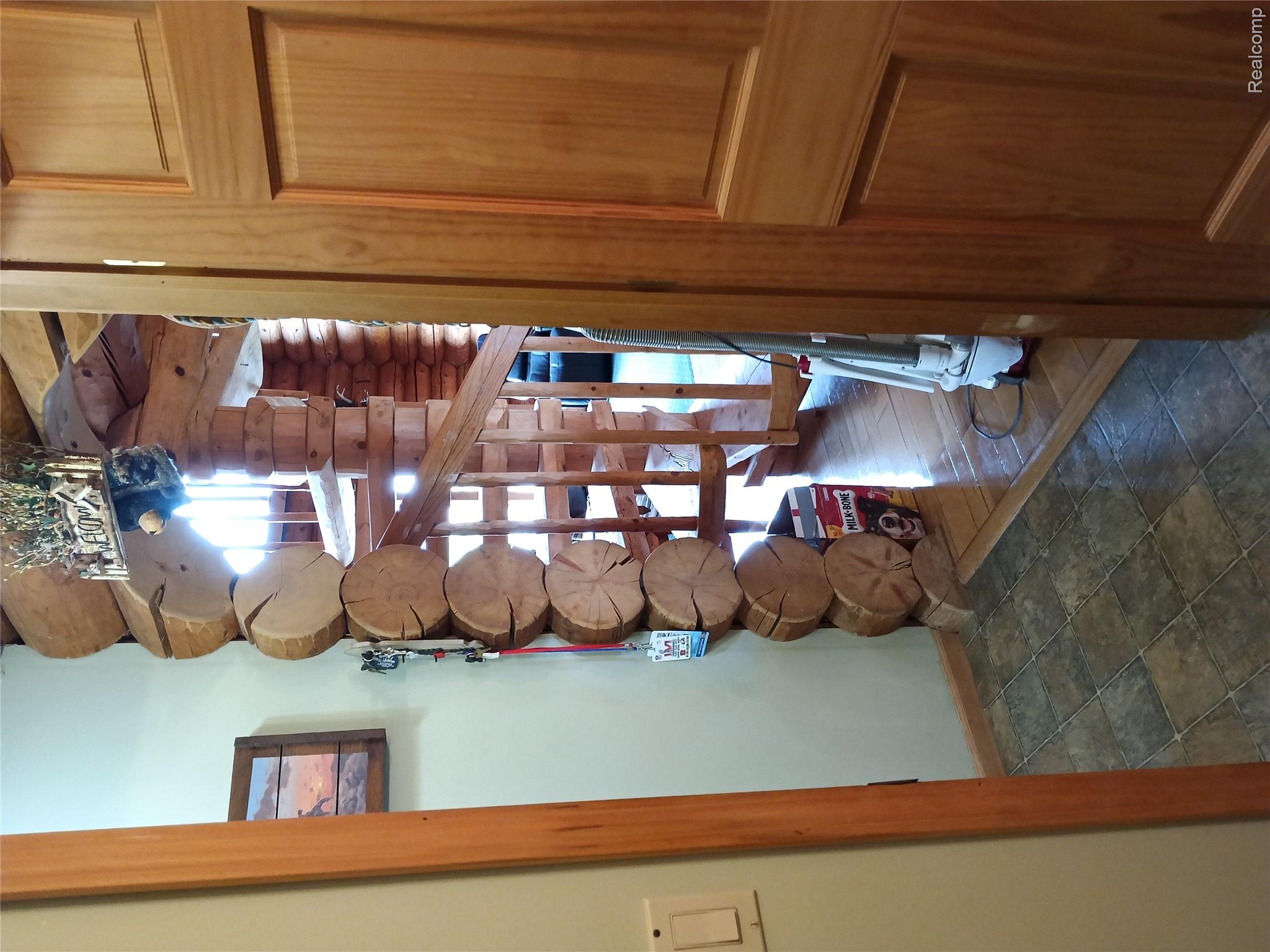 10374 Wilson Road Otisville, MI 48463 - Photo 61 of 99 Hallway with baseboards and dark stone finish floors