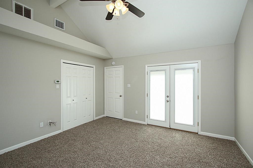 23315 Montague Drive Spring, TX 77373 - Photo 13 of 24 an empty room with a ceiling fan and window