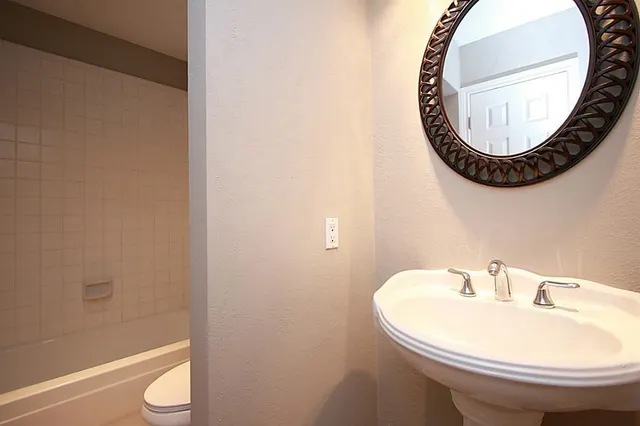 a bathroom with a sink and a mirror