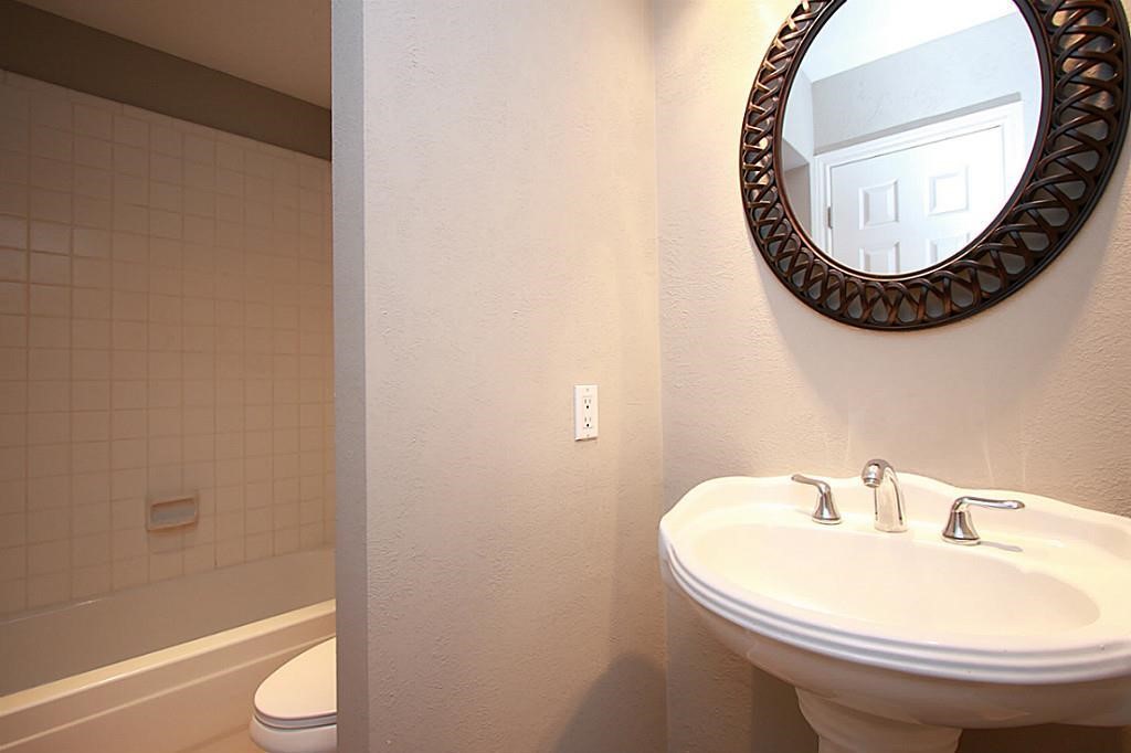 23315 Montague Drive Spring, TX 77373 - Photo 20 of 24 a bathroom with a sink and a mirror