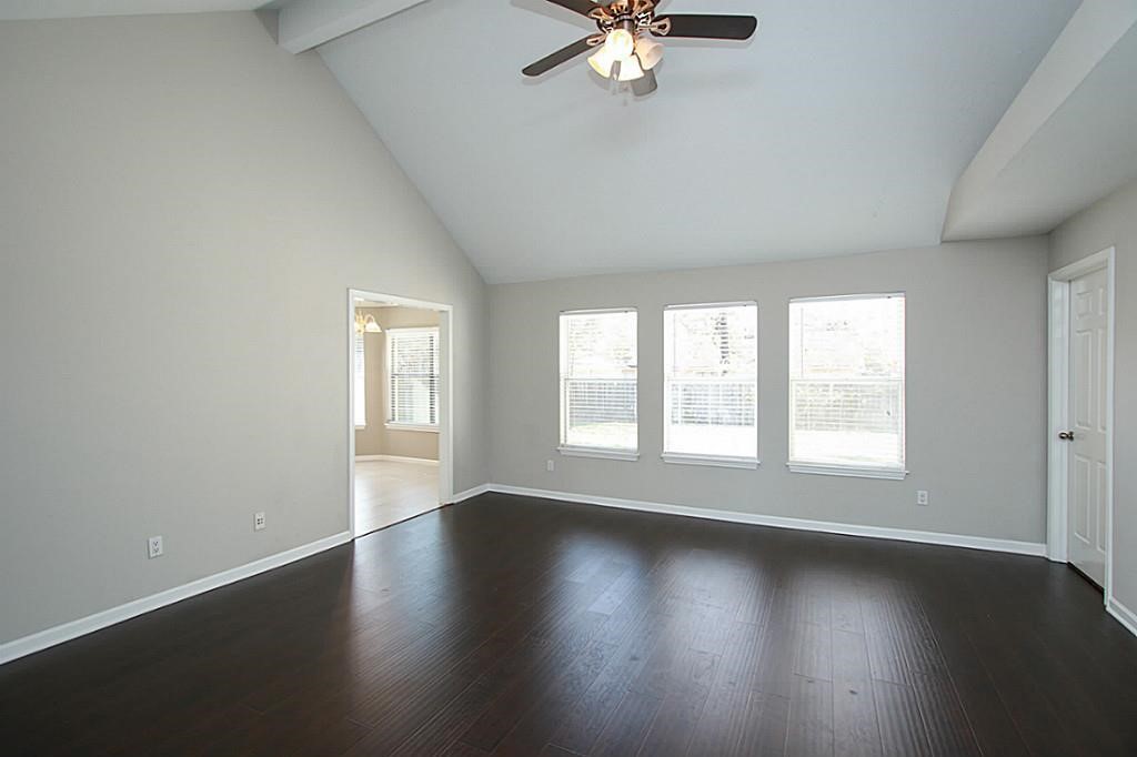 23315 Montague Drive Spring, TX 77373 - Photo 2 of 24 an empty room with wooden floor and windows