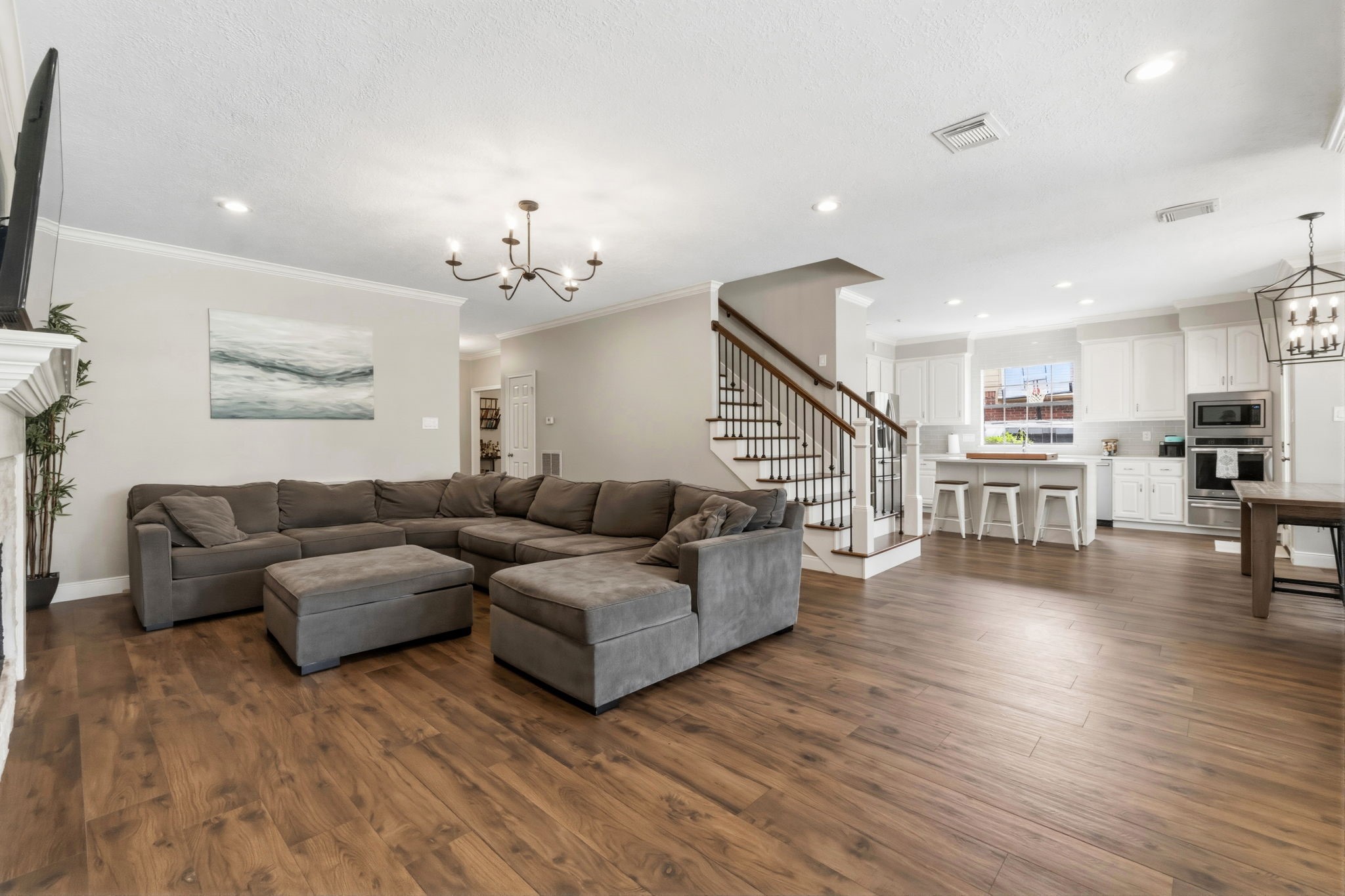 23 Rustic View Court The Woodlands, TX 77381 - Photo 13 of 18 Comfortable open living concept with wood look like tile throughout forst floor and stairs