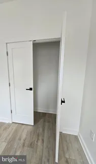 a bathroom with a shower and a sink