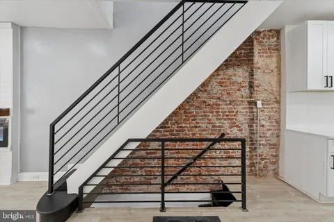 wooden floor with staircase
