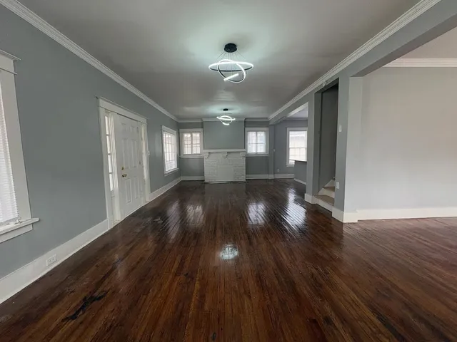a view of gallery with wooden floor