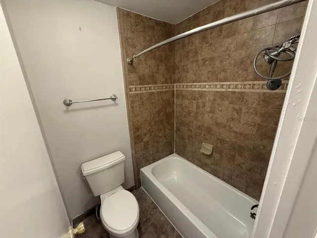 an aerial view of a house with a yard and pool