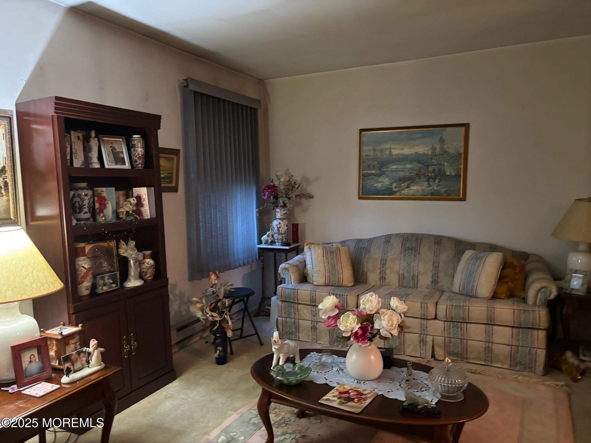 3 Swift Circle, Unit D Whiting, NJ 08759 - Photo 14 of 34 a living room with furniture and a bookshelf