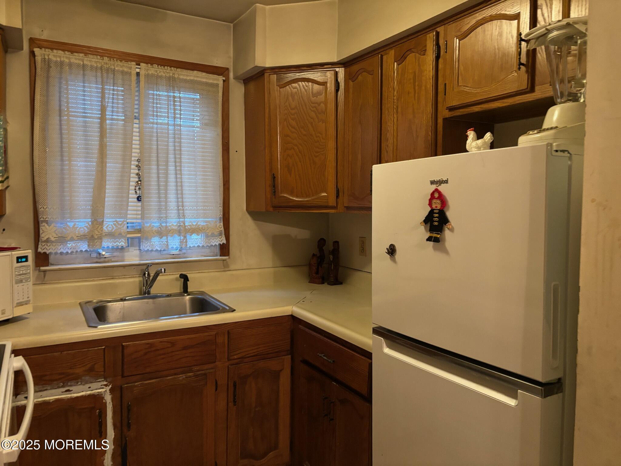3 Swift Circle, Unit D Whiting, NJ 08759 - Photo 20 of 34 a kitchen with stainless steel appliances a refrigerator and a sink