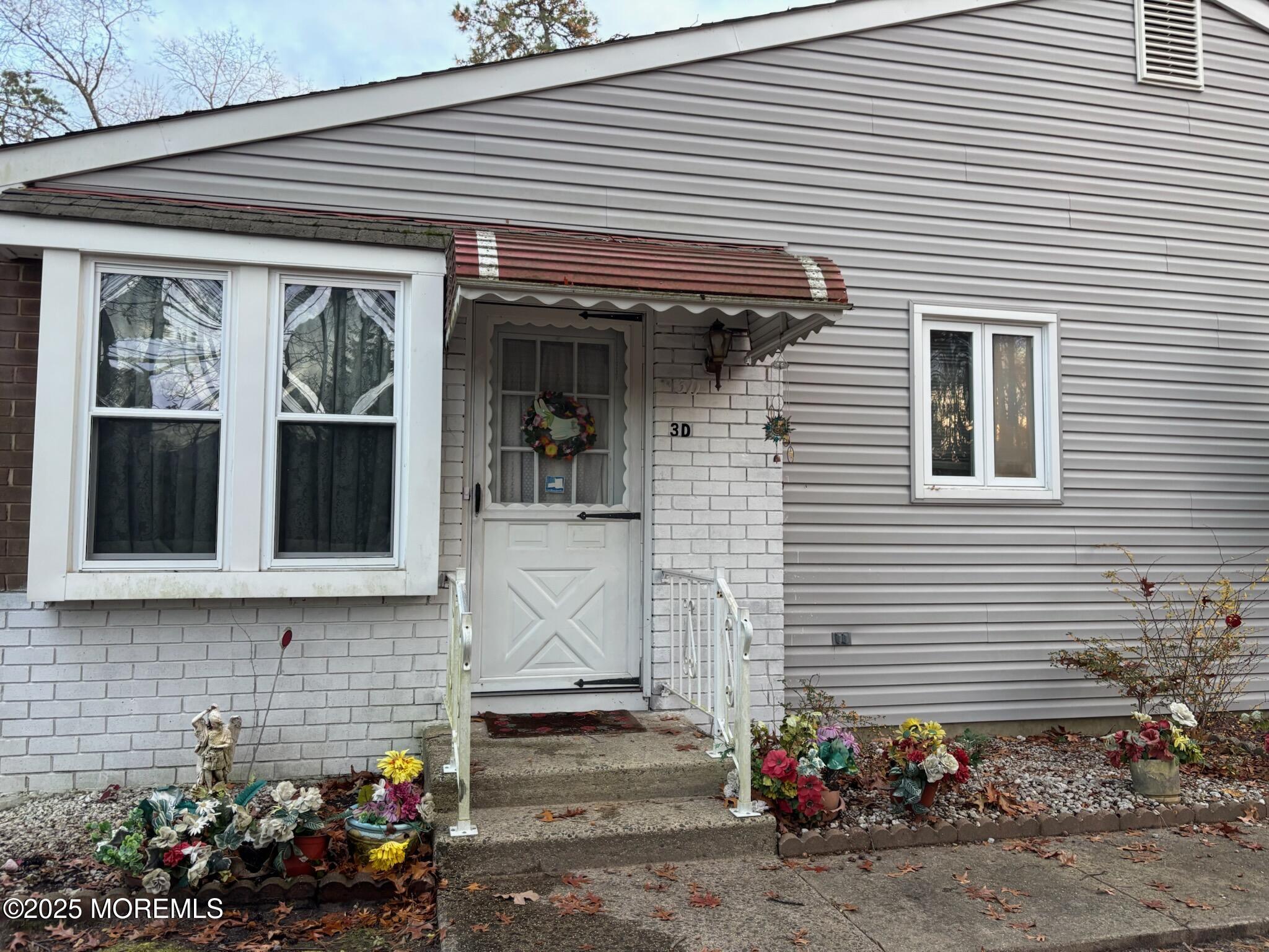 3 Swift Circle, Unit D Whiting, NJ 08759 - Photo 2 of 34 a view of a house with potted plants