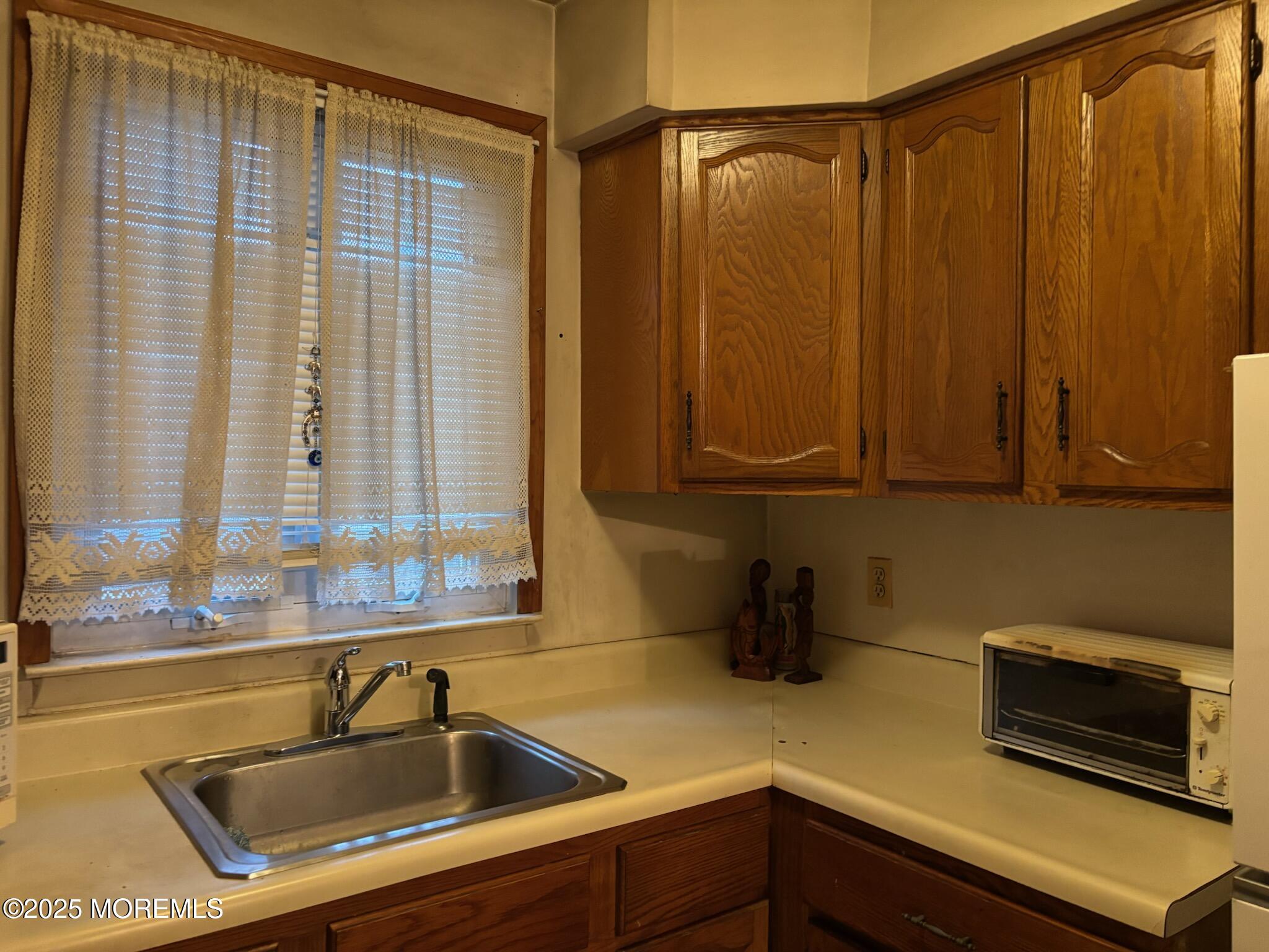 3 Swift Circle, Unit D Whiting, NJ 08759 - Photo 21 of 34 a kitchen with a sink and a window