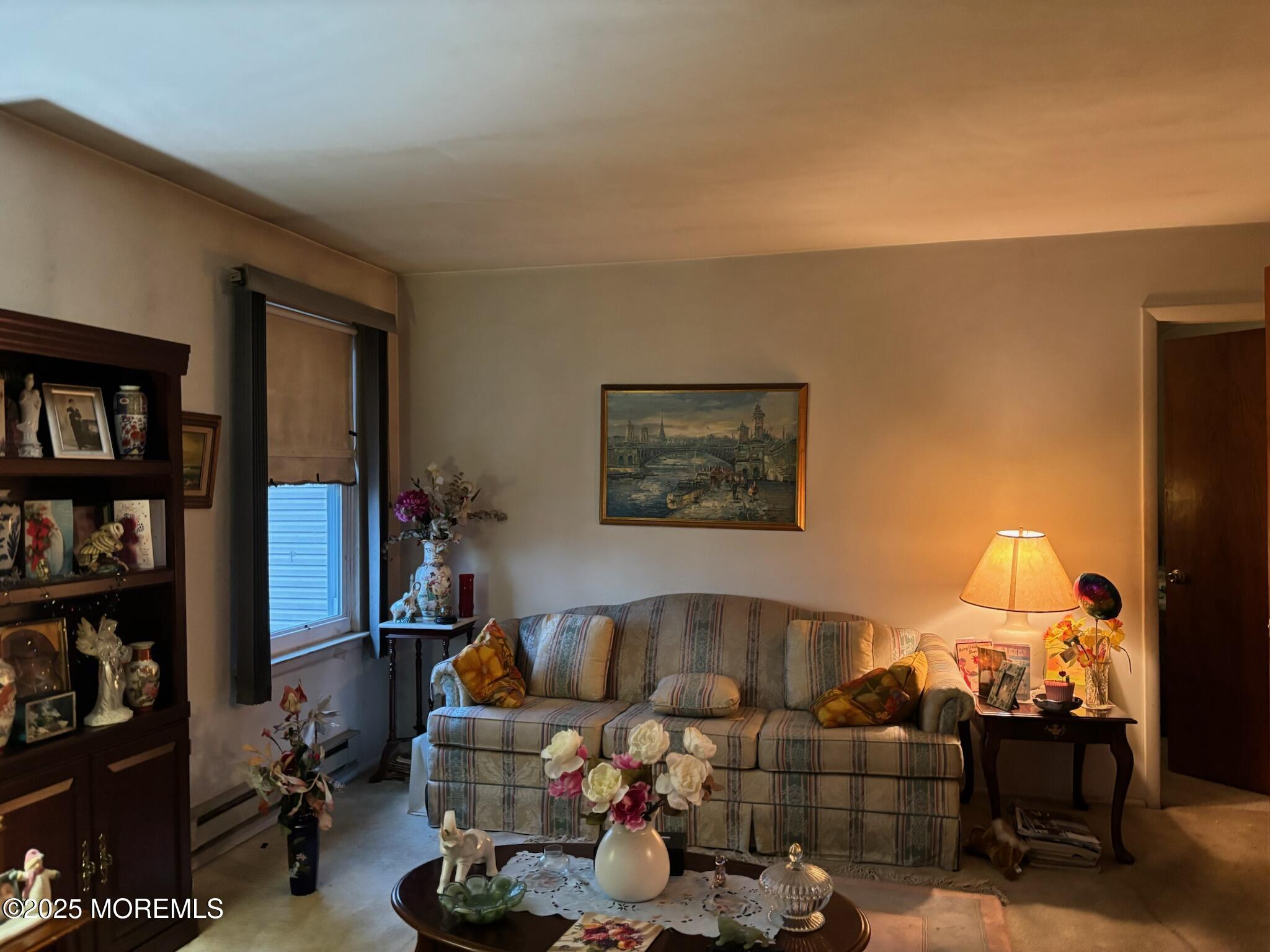 3 Swift Circle, Unit D Whiting, NJ 08759 - Photo 8 of 34 a living room with furniture a lamp and a bookshelf