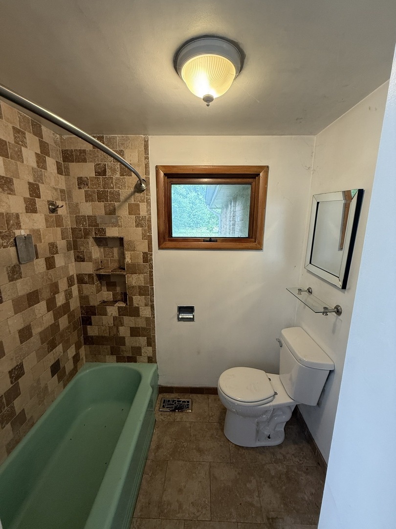 1826 Albert Lane Wilmington, IL 60481 - Photo 12 of 18 a bathroom with a toilet sink and mirror