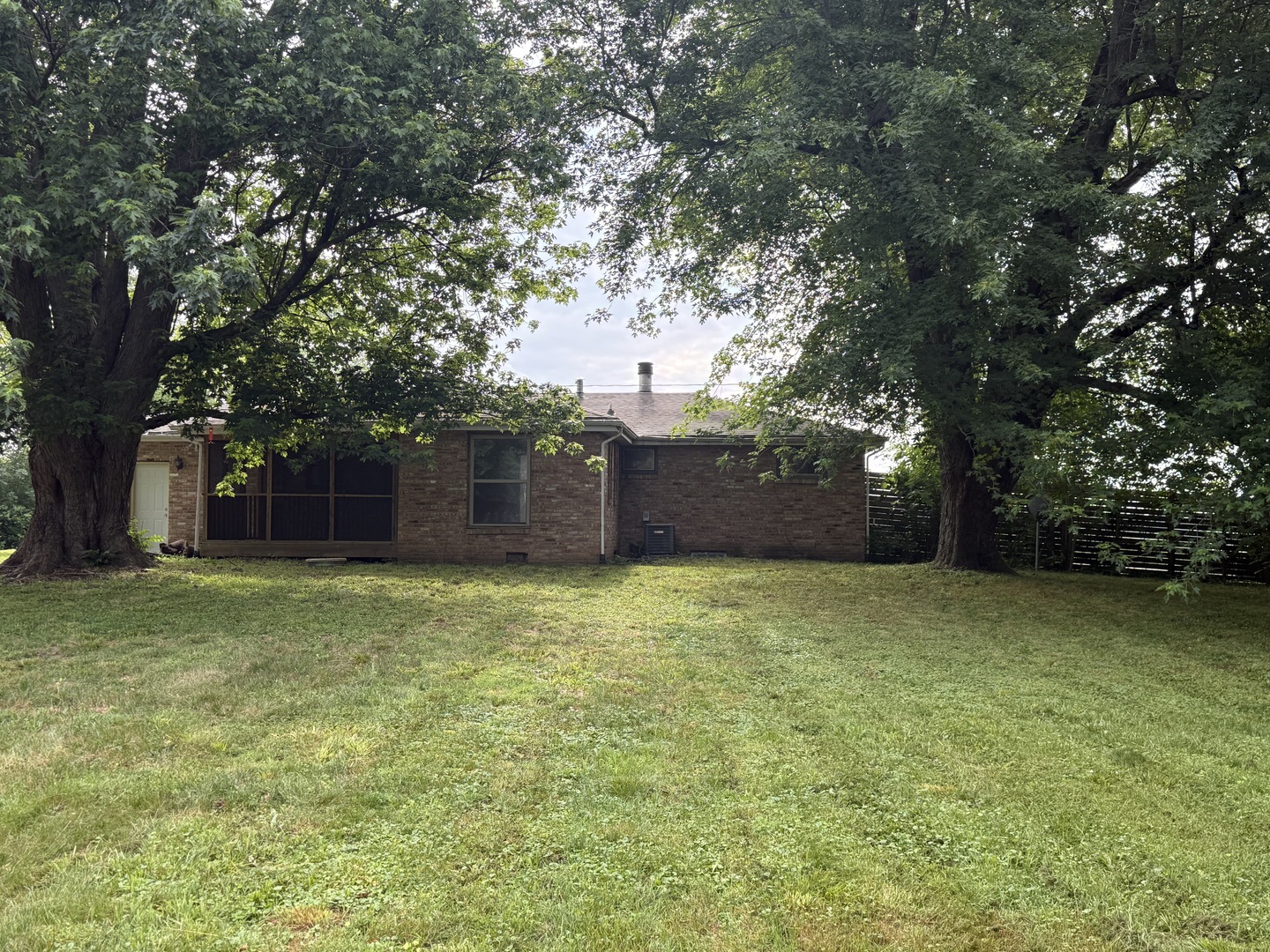 1826 Albert Lane Wilmington, IL 60481 - Photo 6 of 18 a backyard of a house with lots of green space