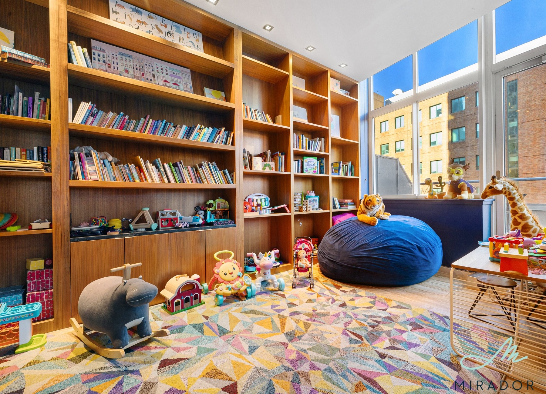 80 Dekalb Avenue, Unit 30C Brooklyn, NY 11201 - Photo 14 of 28 a room with a book shelf and a book shelf