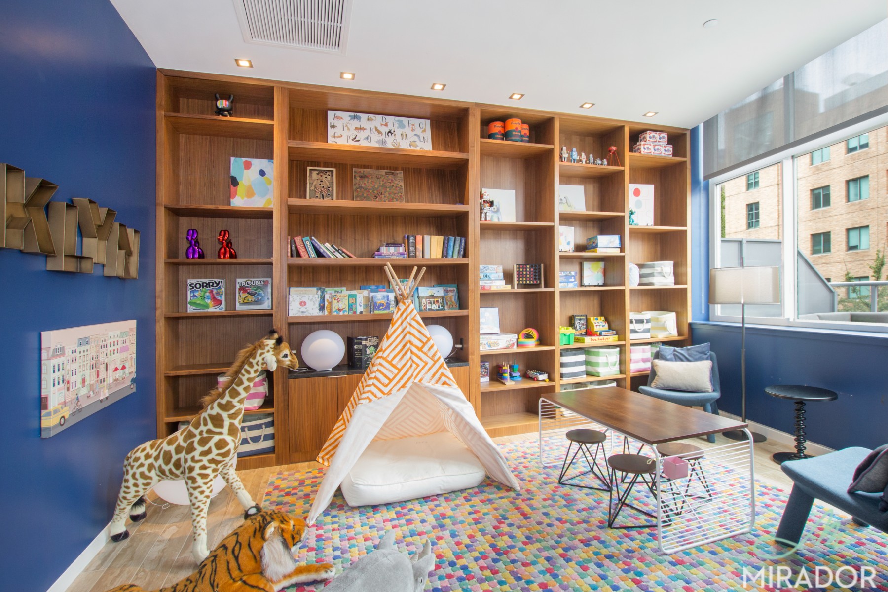 80 Dekalb Avenue, Unit 30C Brooklyn, NY 11201 - Photo 19 of 28 a living room with furniture a rug and a book shelf