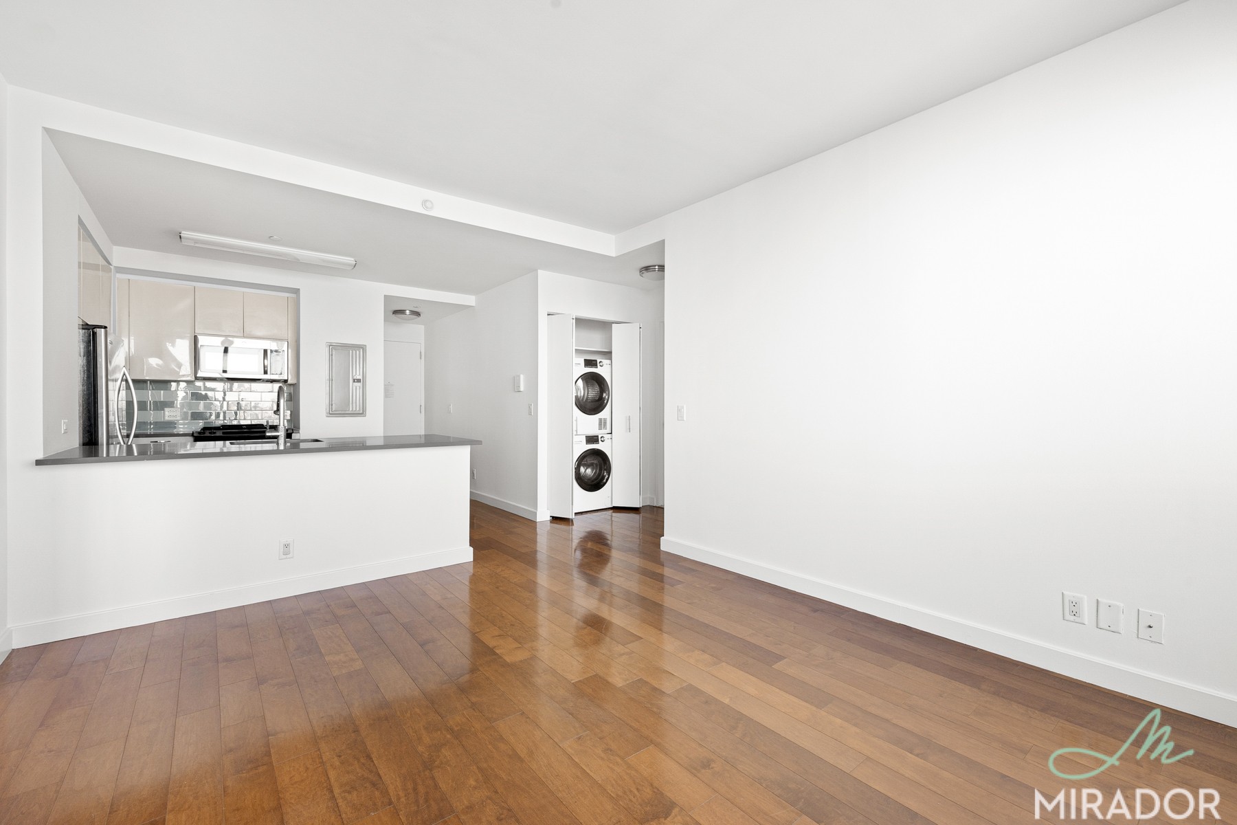 80 Dekalb Avenue, Unit 30C Brooklyn, NY 11201 - Photo 9 of 28 a view of empty room with wooden floor