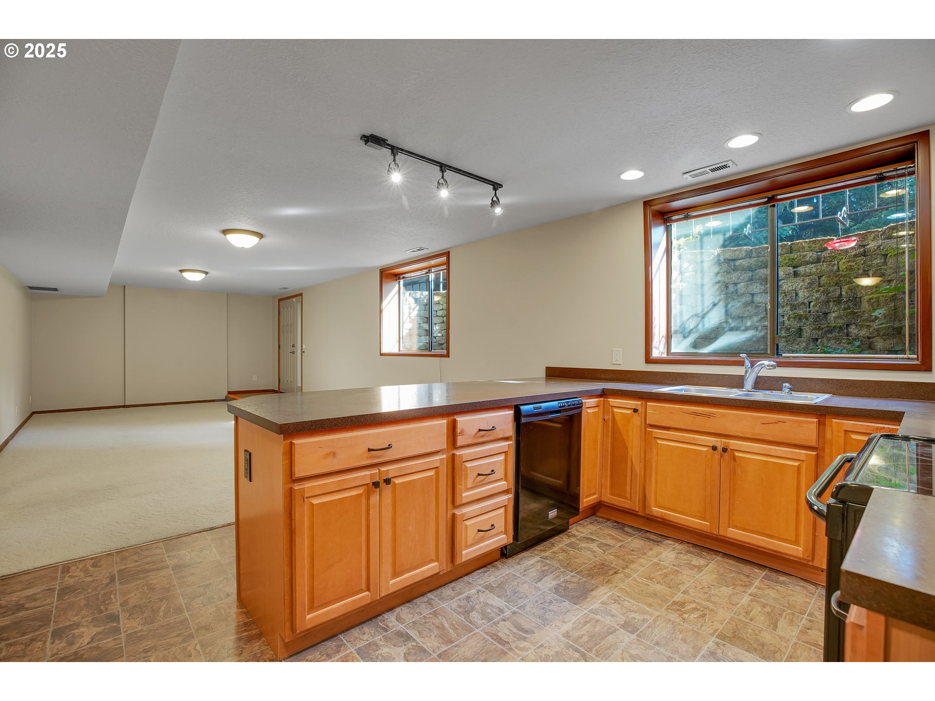 8710 Southeast 57th Avenue Portland, OR 97206 - Photo 32 of 47 a kitchen with stainless steel appliances granite countertop sink stove and refrigerator