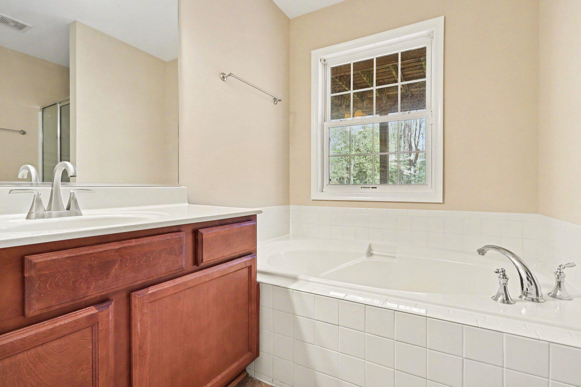 876 Campers Lane Ruther Glen, VA 22546 - Photo 14 of 27 a bathroom with a sink and a bathtub