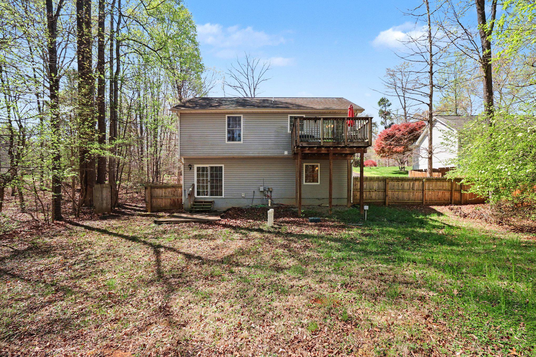 876 Campers Lane Ruther Glen, VA 22546 - Photo 19 of 27 a view of a house with a yard