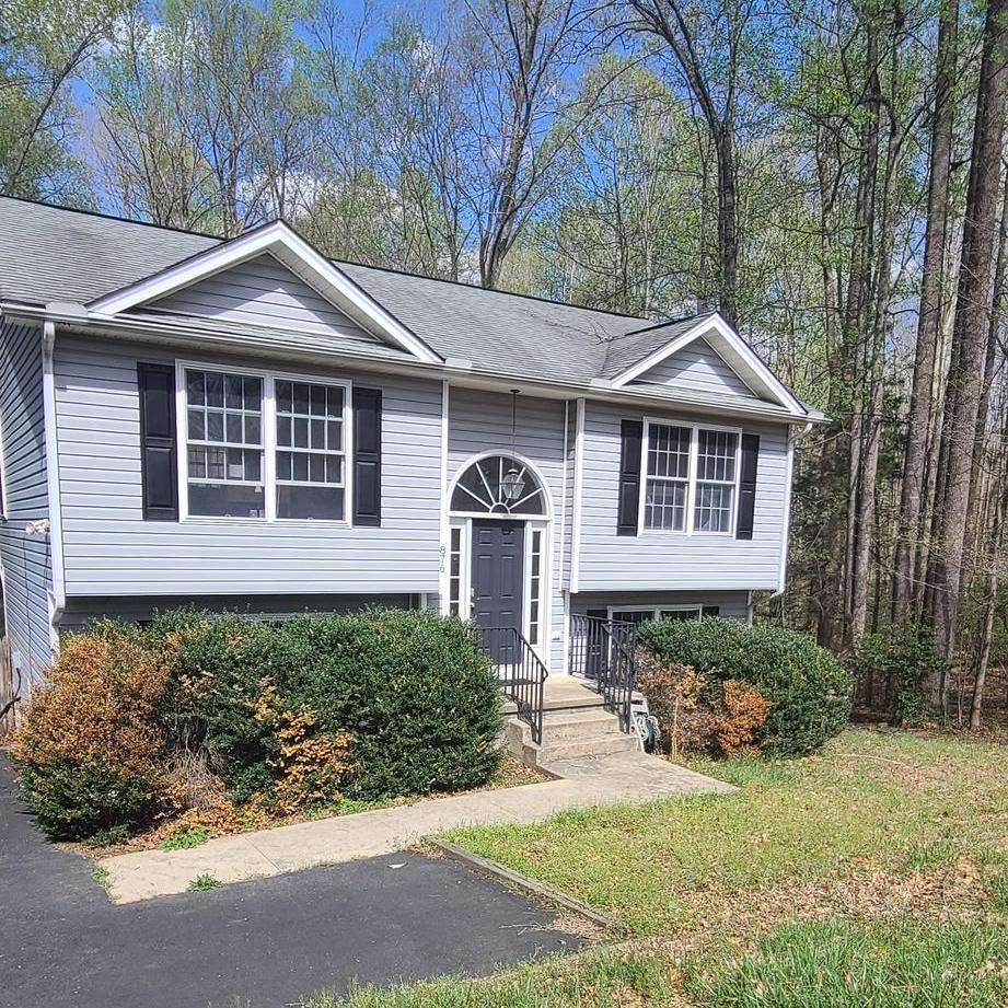 876 Campers Lane Ruther Glen, VA 22546 - Photo 22 of 27 a front view of a house with a yard