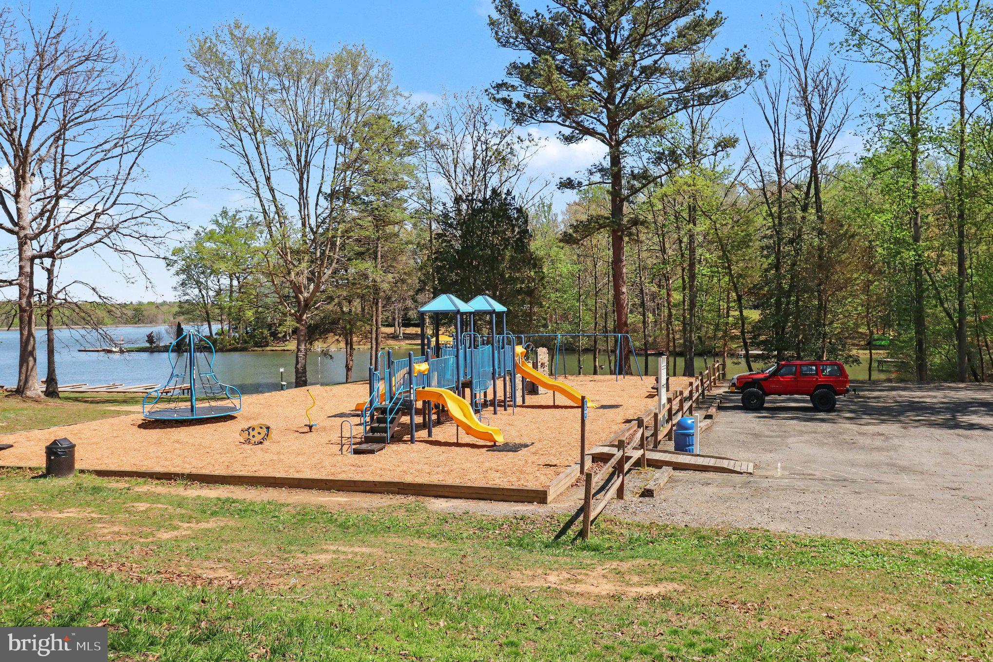 876 Campers Lane Ruther Glen, VA 22546 - Photo 26 of 27 a view of a park with swings and slides