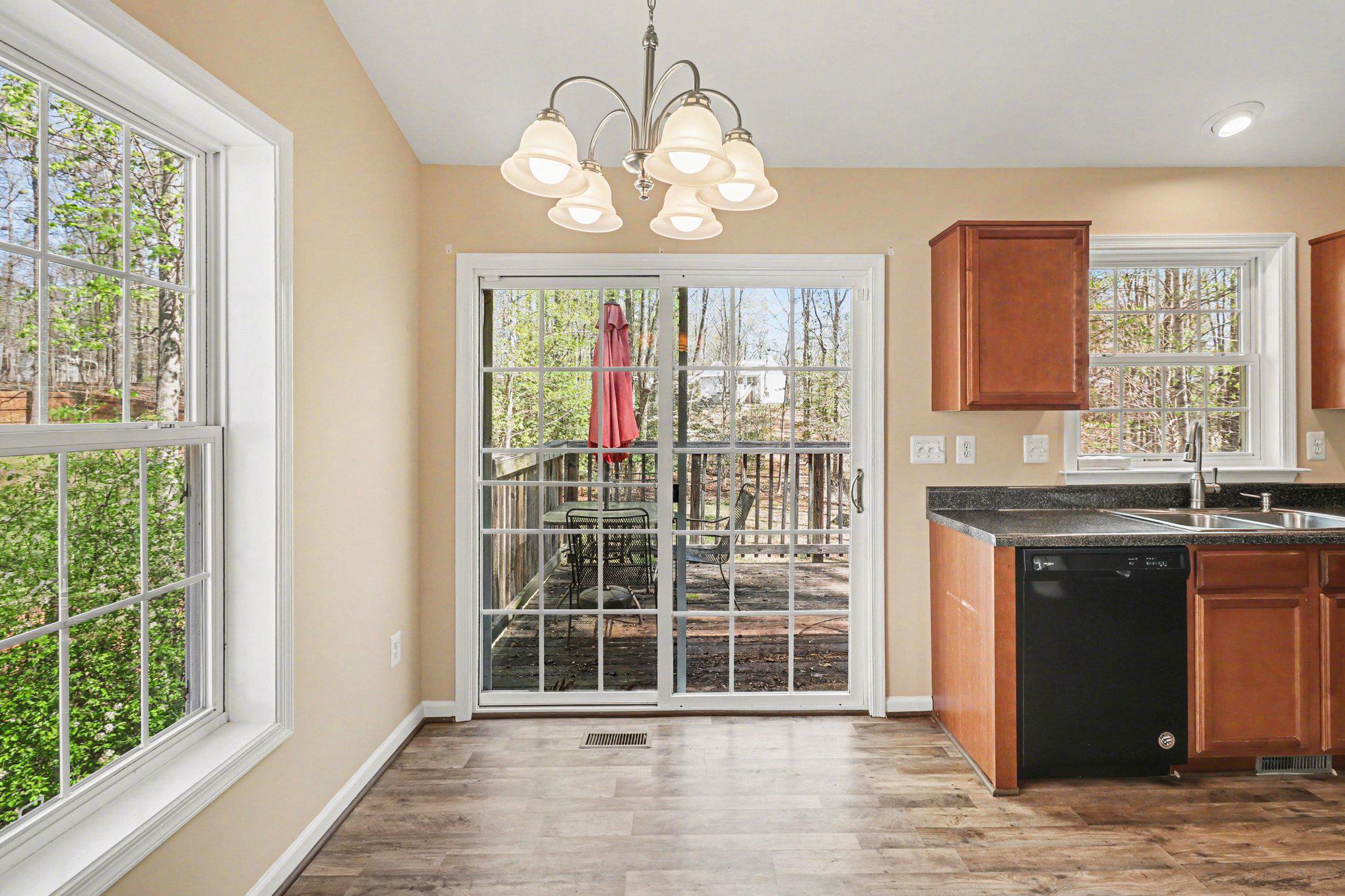 876 Campers Lane Ruther Glen, VA 22546 - Photo 6 of 27 an empty room with wooden floor and windows