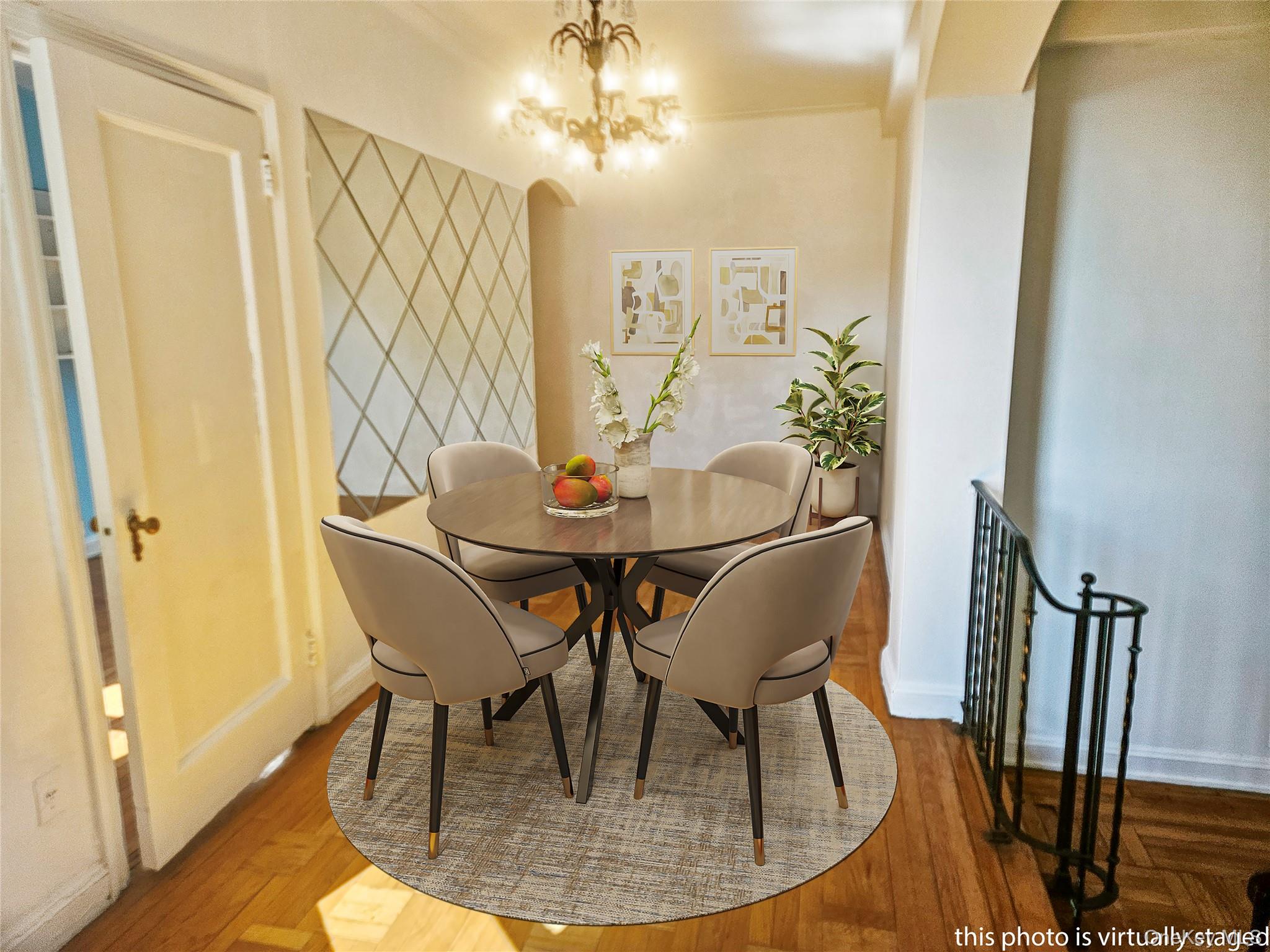 72-15 37th Avenue, Unit 3H Queens, NY 11372 - Photo 4 of 14 Dining room featuring a chandelier and baseboards