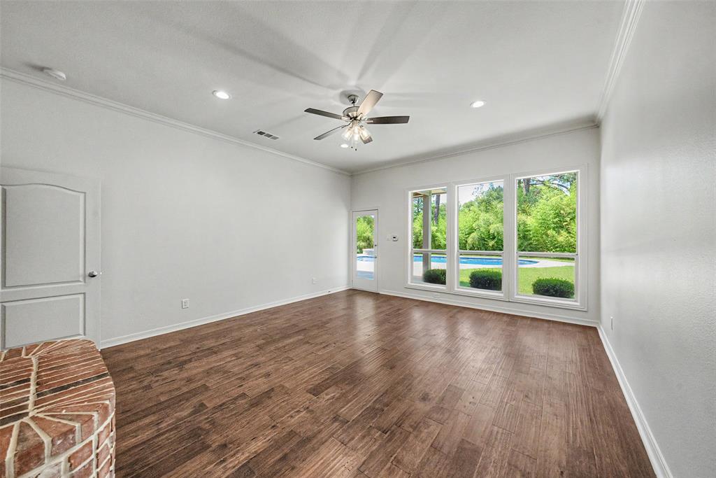 1200 Mount Gilead Road Keller, TX 76262 - Photo 21 of 38 a view of an empty room with a window and wooden floor