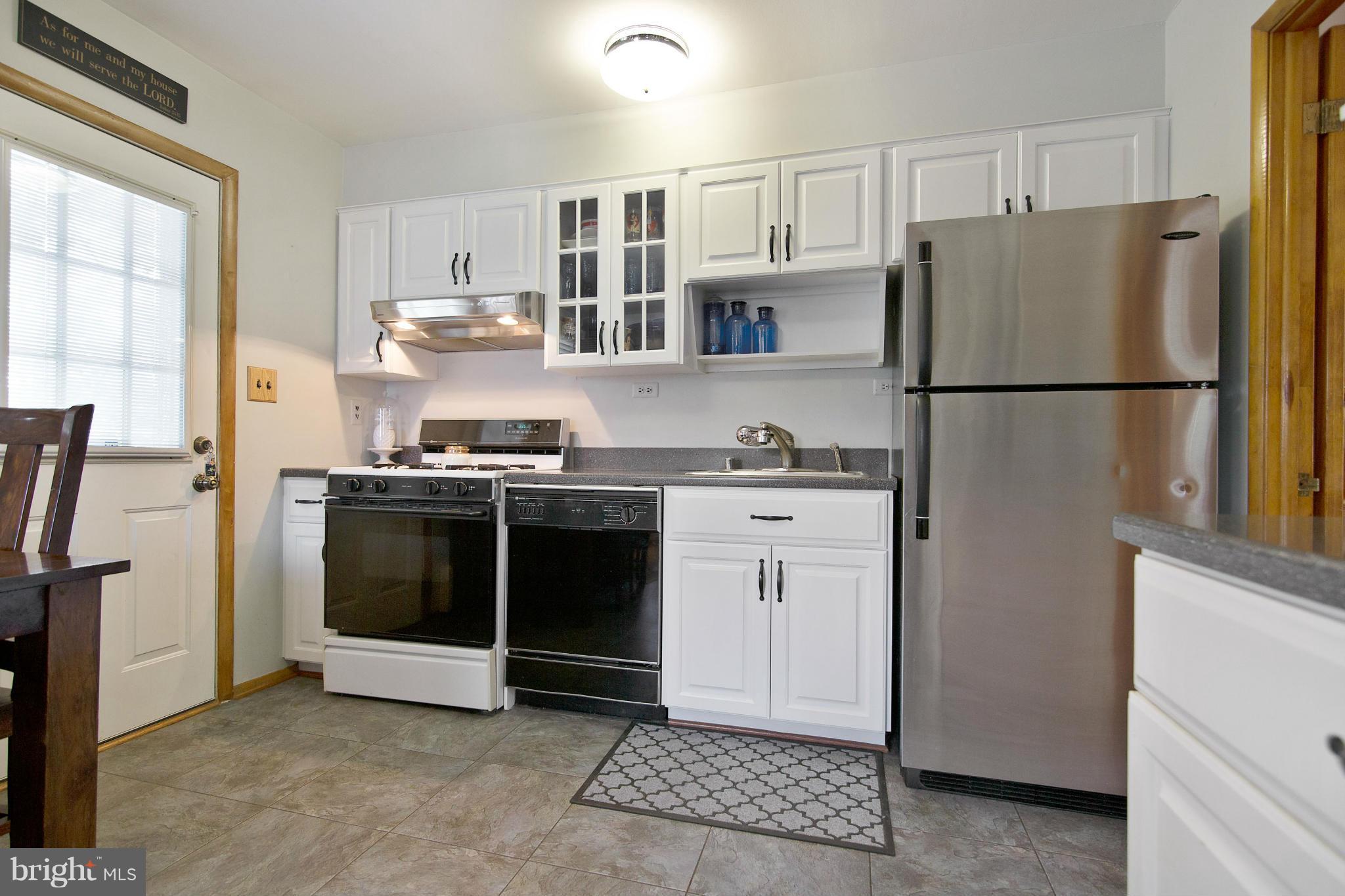 451 West Maple Road Linthicum Heights, MD 21090 - Photo 11 of 30 a kitchen with stainless steel appliances a refrigerator sink and cabinets