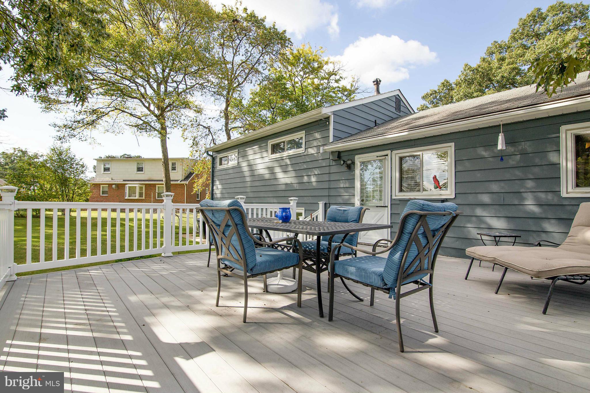 451 West Maple Road Linthicum Heights, MD 21090 - Photo 13 of 30 a view of a chairs and table on the deck