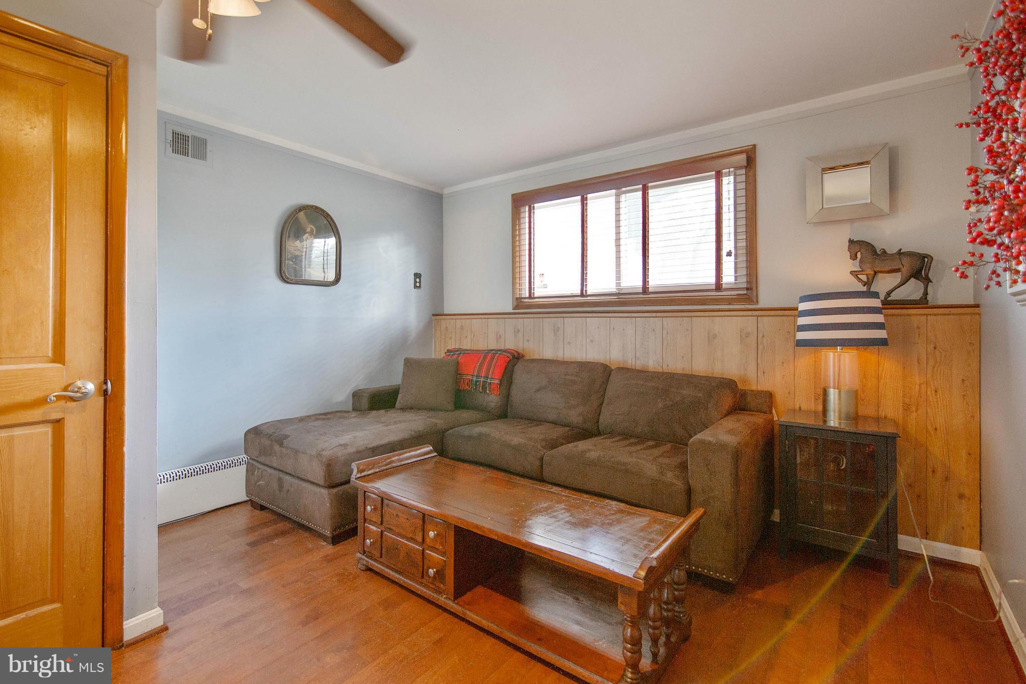 451 West Maple Road Linthicum Heights, MD 21090 - Photo 20 of 30 a living room with furniture and a window