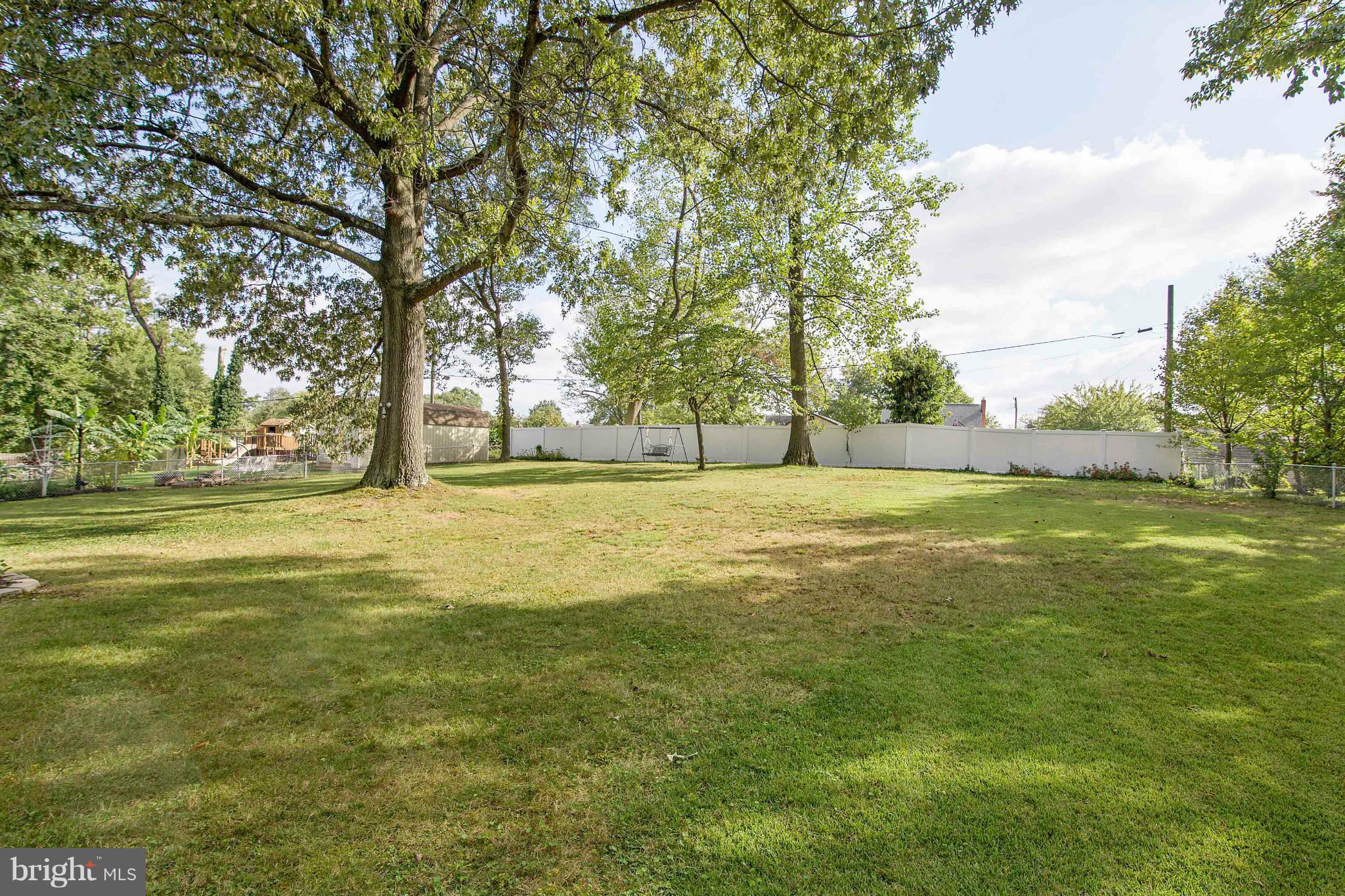 451 West Maple Road Linthicum Heights, MD 21090 - Photo 3 of 30 a view of an ocean with a big yard and large trees