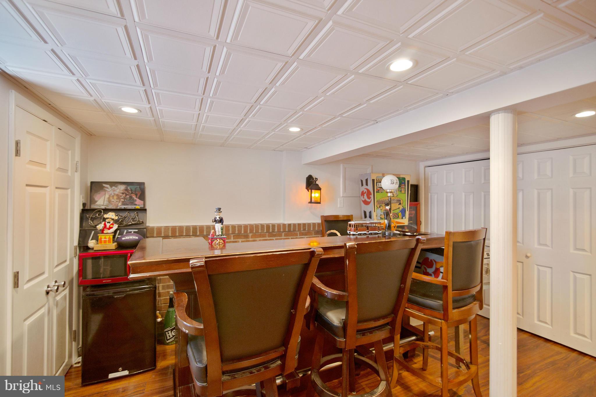 451 West Maple Road Linthicum Heights, MD 21090 - Photo 23 of 30 a dining hall with stainless steel appliances a table and chairs