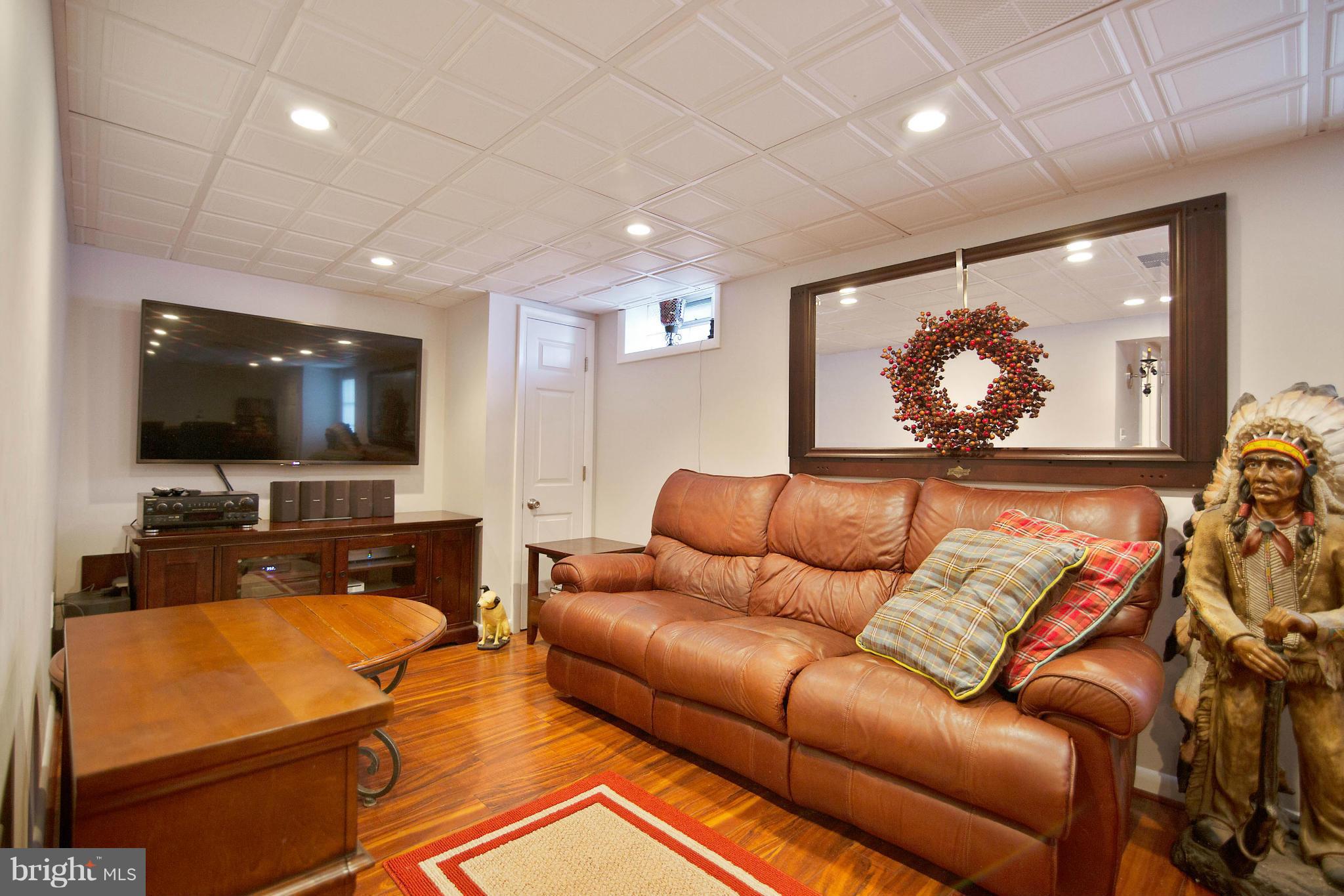 451 West Maple Road Linthicum Heights, MD 21090 - Photo 25 of 30 a living room with furniture and a flat screen tv