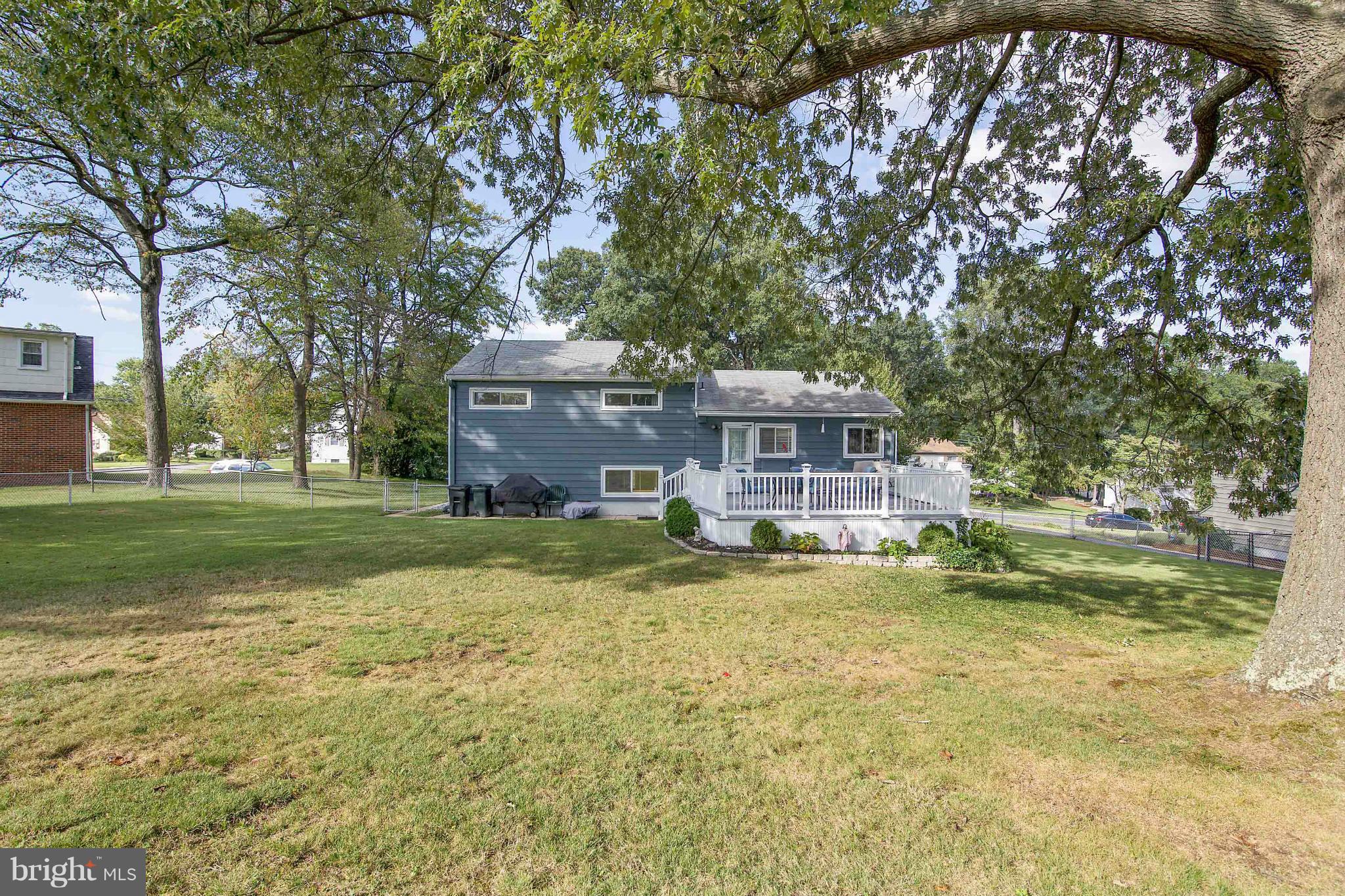 451 West Maple Road Linthicum Heights, MD 21090 - Photo 29 of 30 a front view of a house with a yard table and chairs