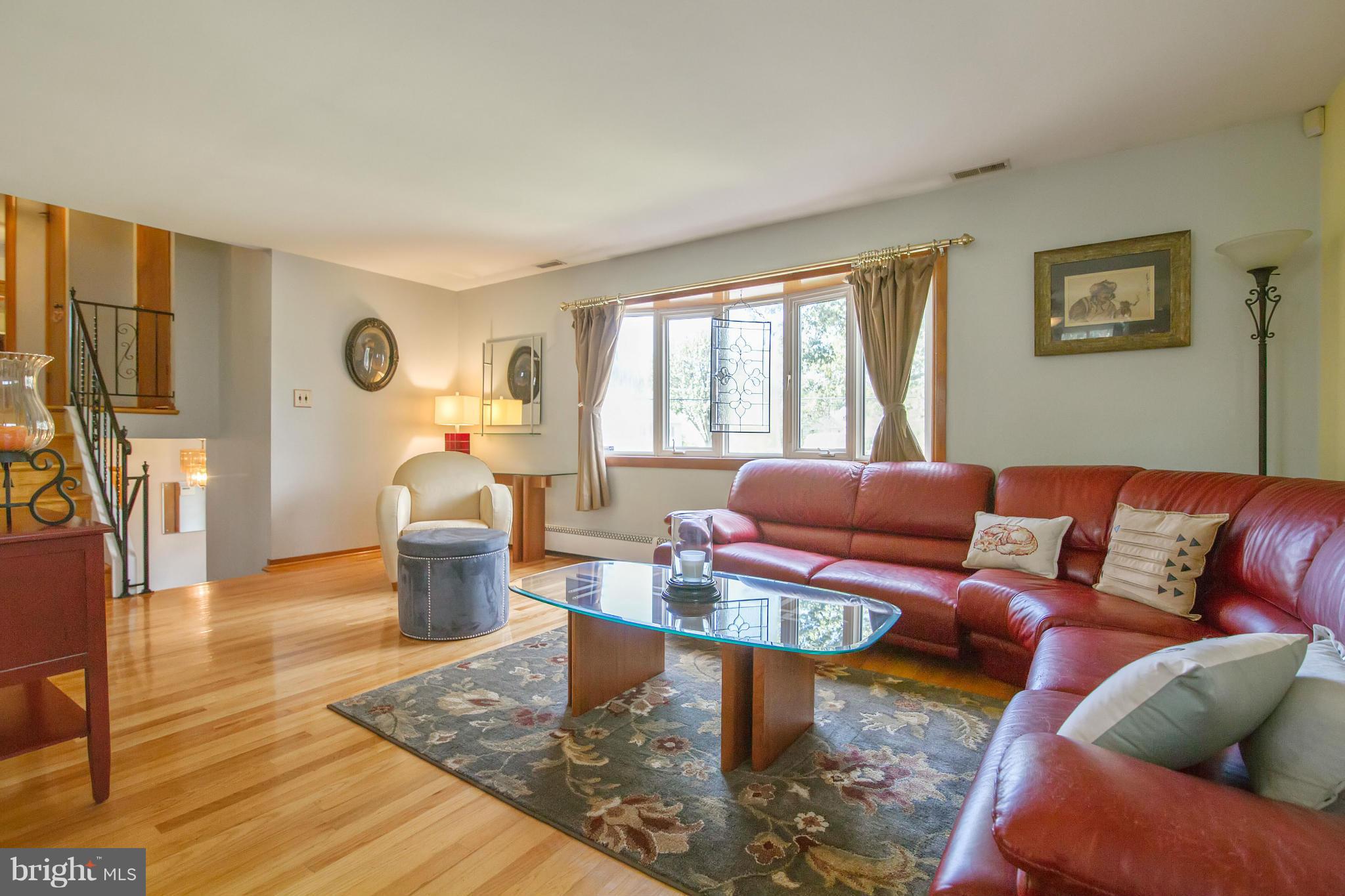 451 West Maple Road Linthicum Heights, MD 21090 - Photo 5 of 30 a living room with furniture a couch and a table