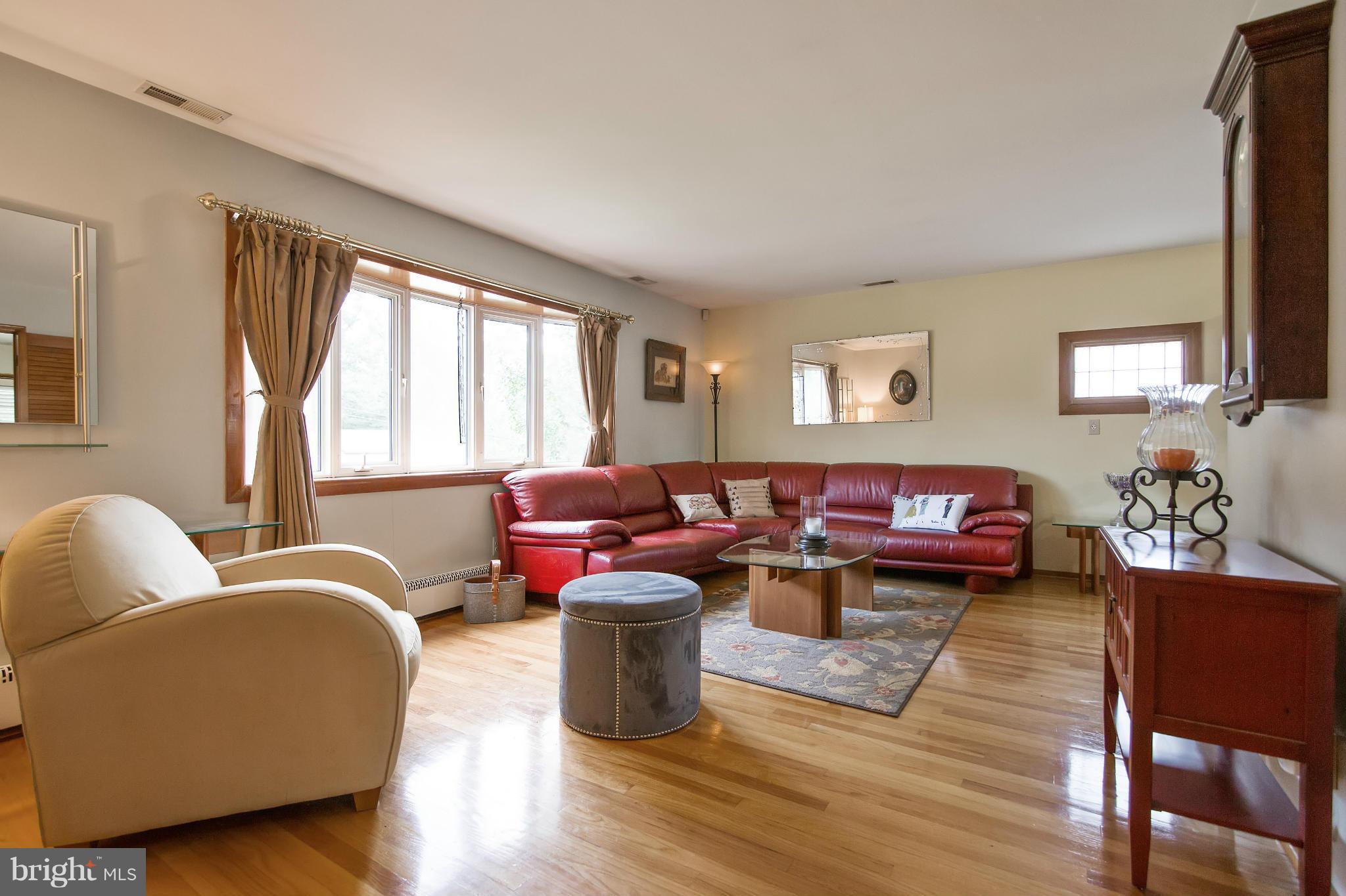 451 West Maple Road Linthicum Heights, MD 21090 - Photo 6 of 30 a living room with furniture and a large window