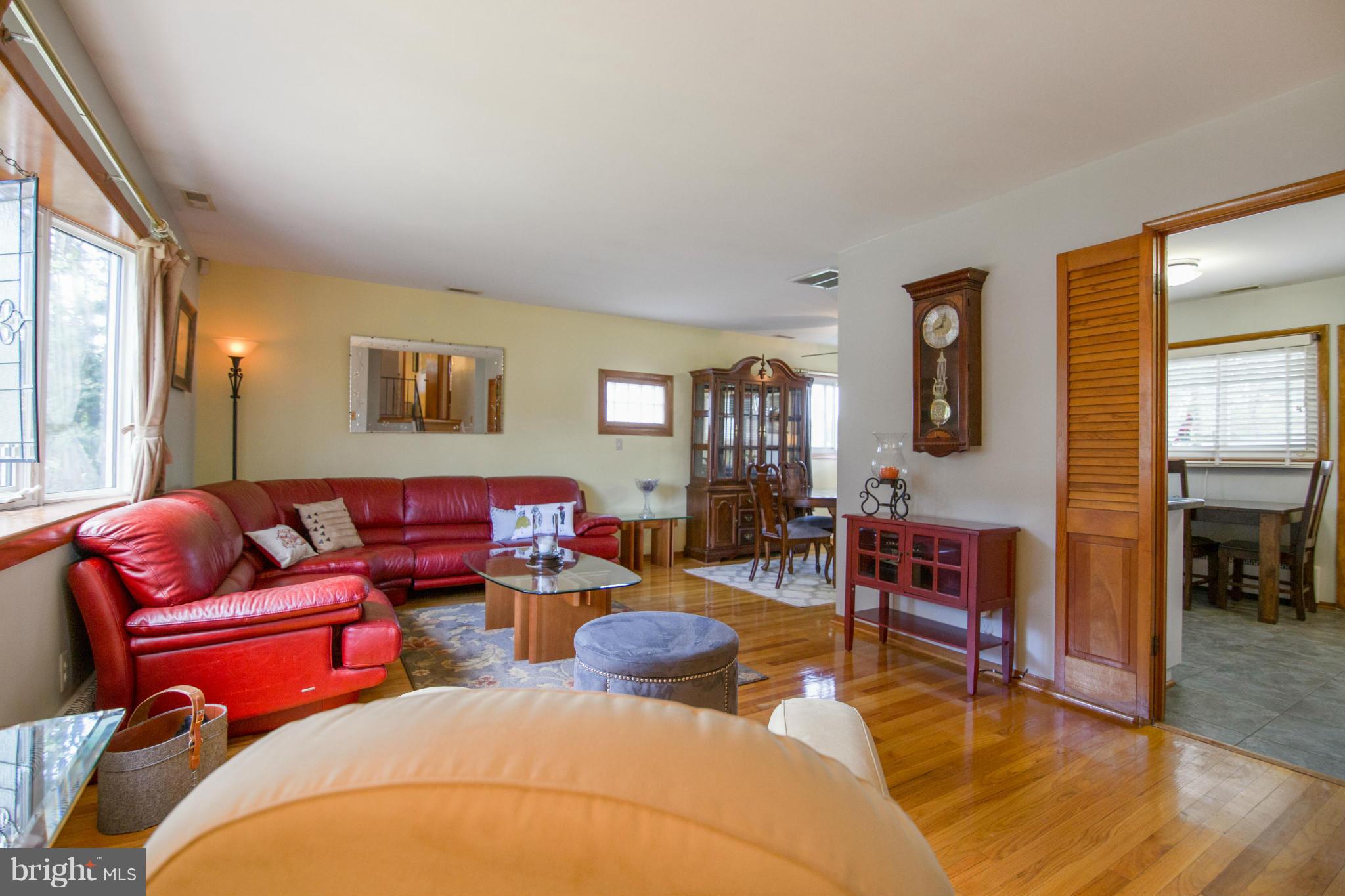 451 West Maple Road Linthicum Heights, MD 21090 - Photo 7 of 30 a living room with furniture a couch and wooden floor