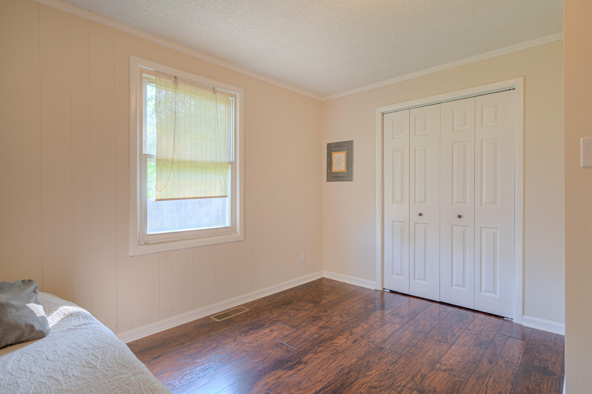 5216 Colonial Drive Dublin, VA 24084 - Photo 22 of 31 a view of an empty room with wooden floor and a window