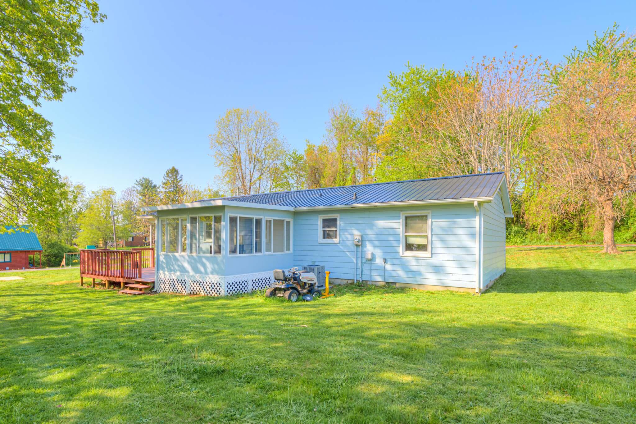 5216 Colonial Drive Dublin, VA 24084 - Photo 31 of 31 a view of a house with a backyard and a patio