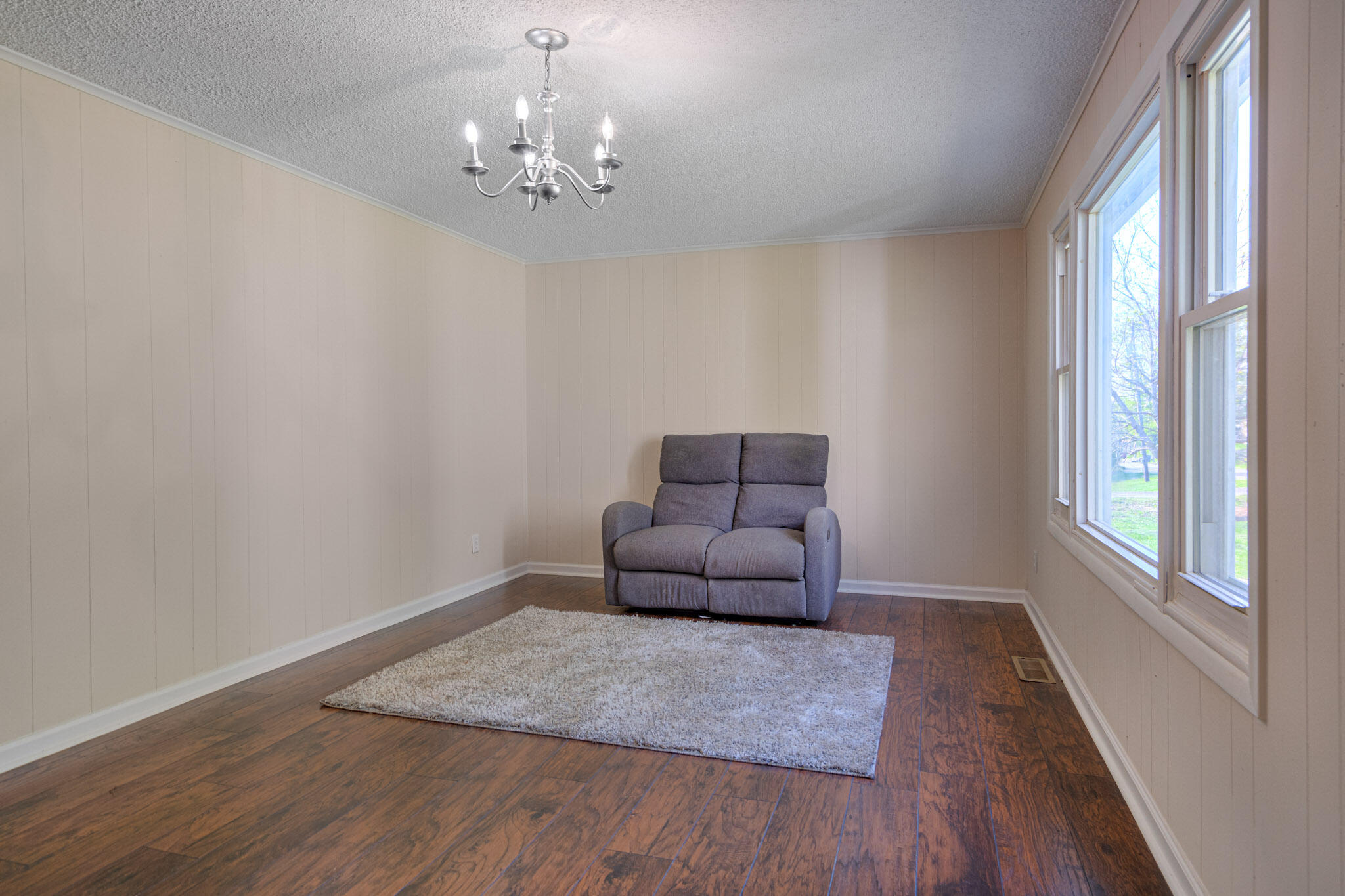 5216 Colonial Drive Dublin, VA 24084 - Photo 5 of 31 a living room with furniture and a chandelier