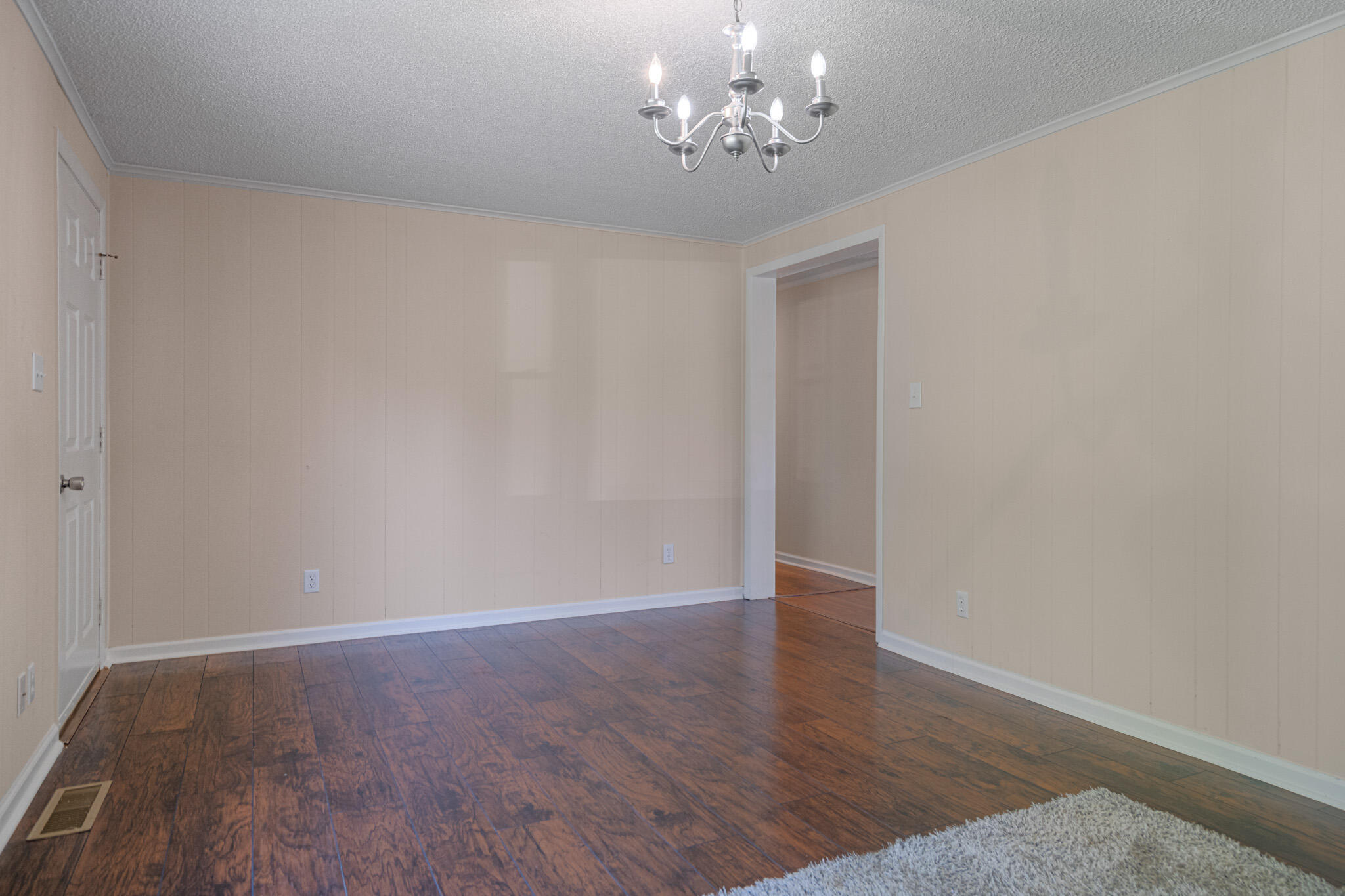 5216 Colonial Drive Dublin, VA 24084 - Photo 6 of 31 a view of an empty room with wooden floor