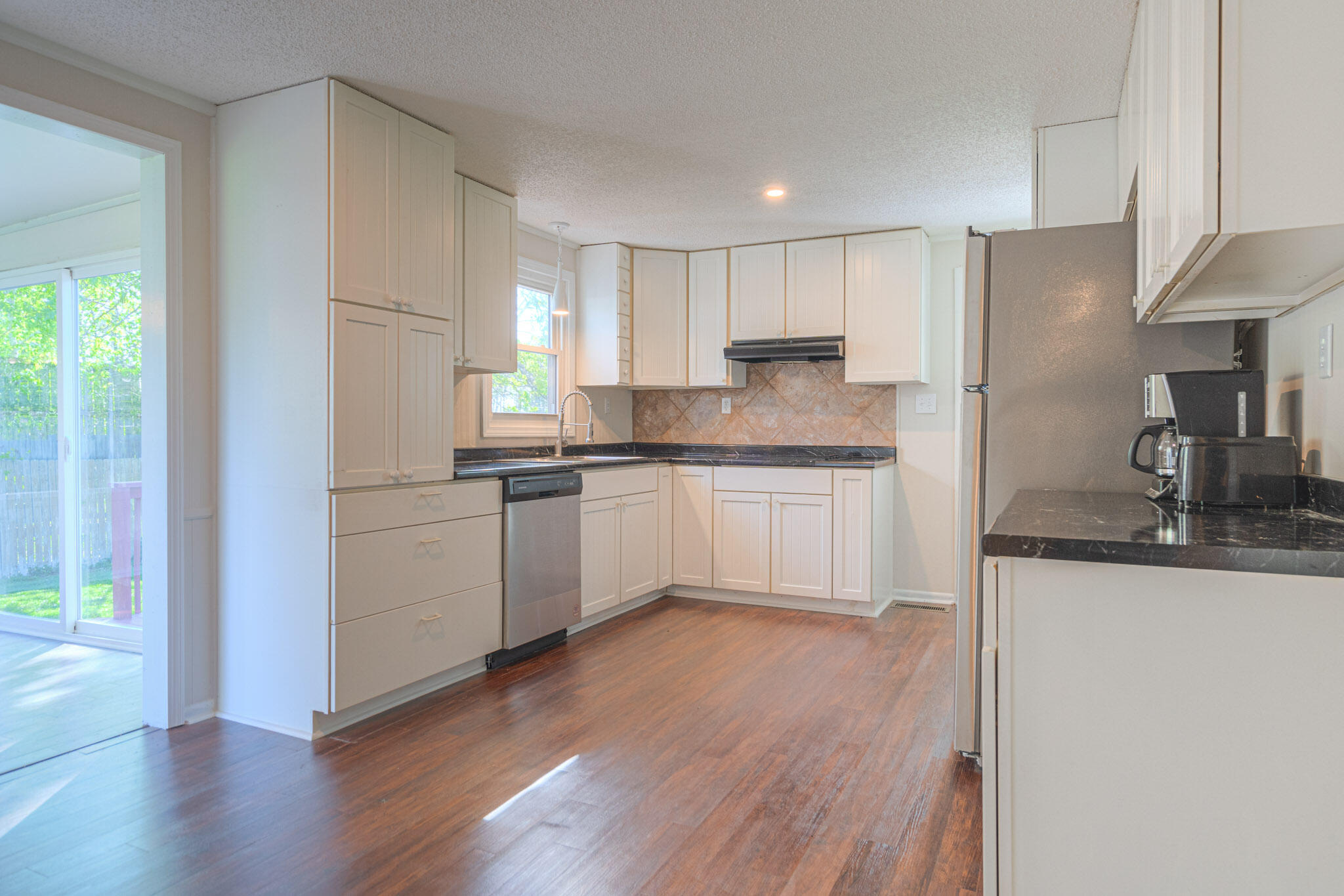 5216 Colonial Drive Dublin, VA 24084 - Photo 7 of 31 a kitchen with a sink a window and stainless steel appliances