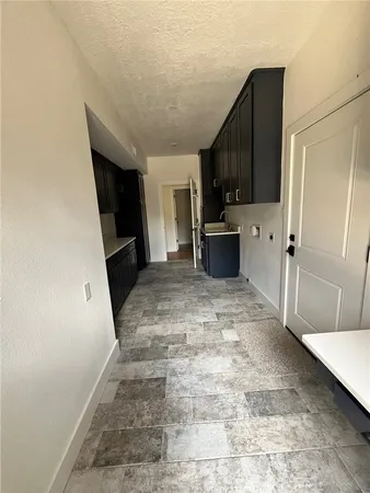 a view of a kitchen with a sink