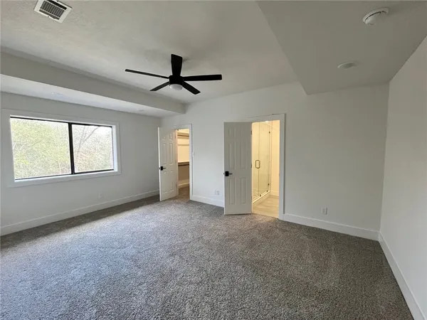 a view of empty room with windows