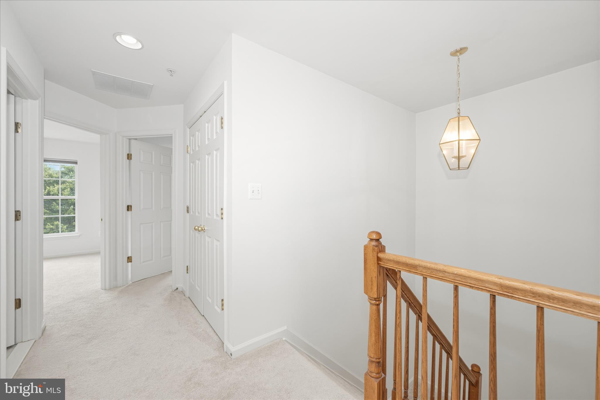 21 Inkberry Circle Gaithersburg, MD 20877 - Photo 27 of 51 a view of hallway with chandelier fan
