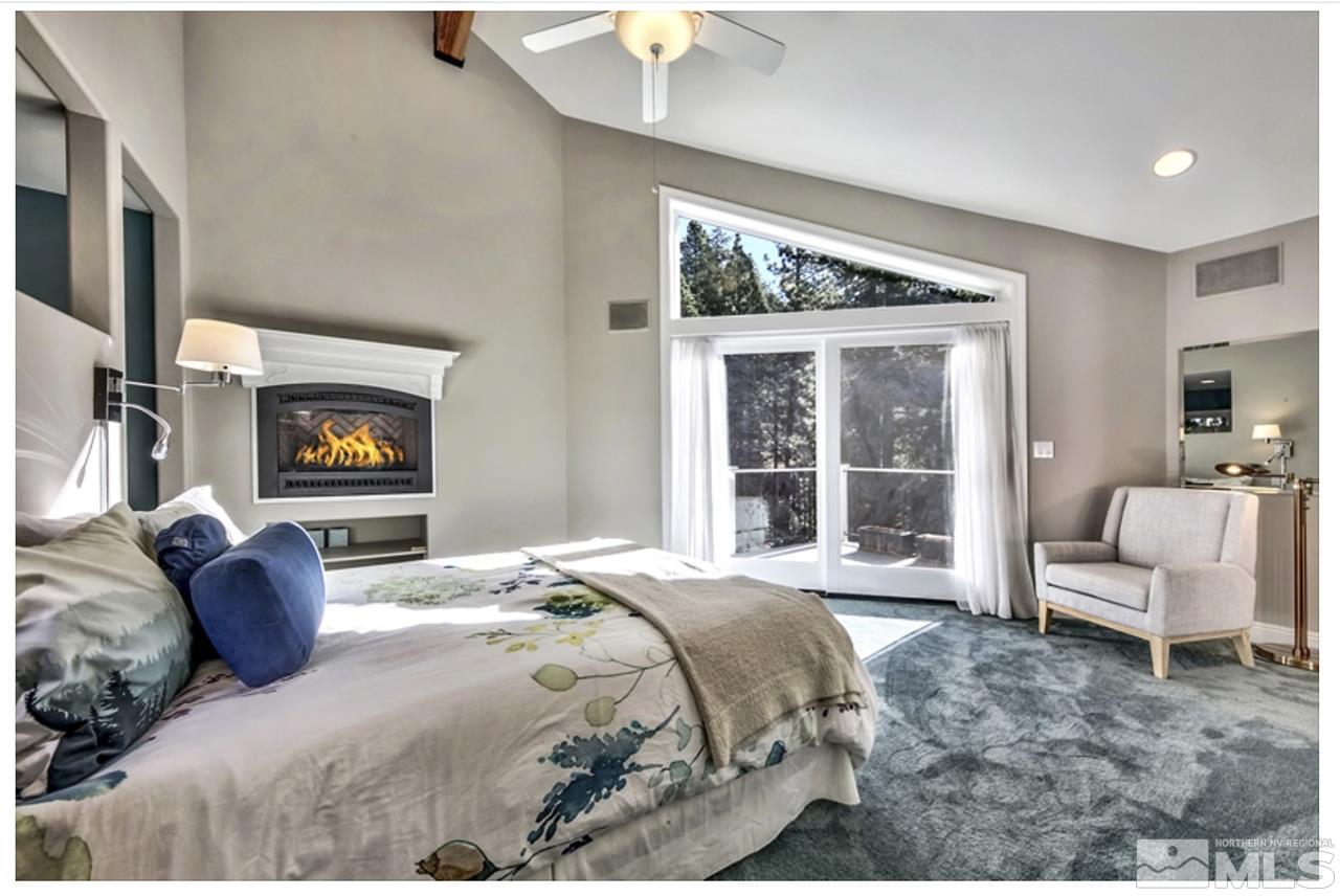 170 Granite Drive Stateline, NV 89449 - Photo 12 of 25 a bedroom with a bed and a large window with balcony view