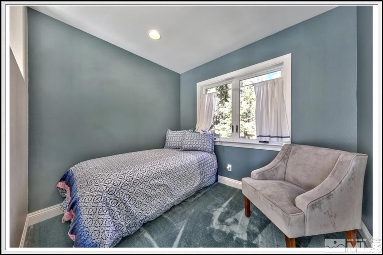 170 Granite Drive Stateline, NV 89449 - Photo 17 of 25 a bedroom with a bed and a couch