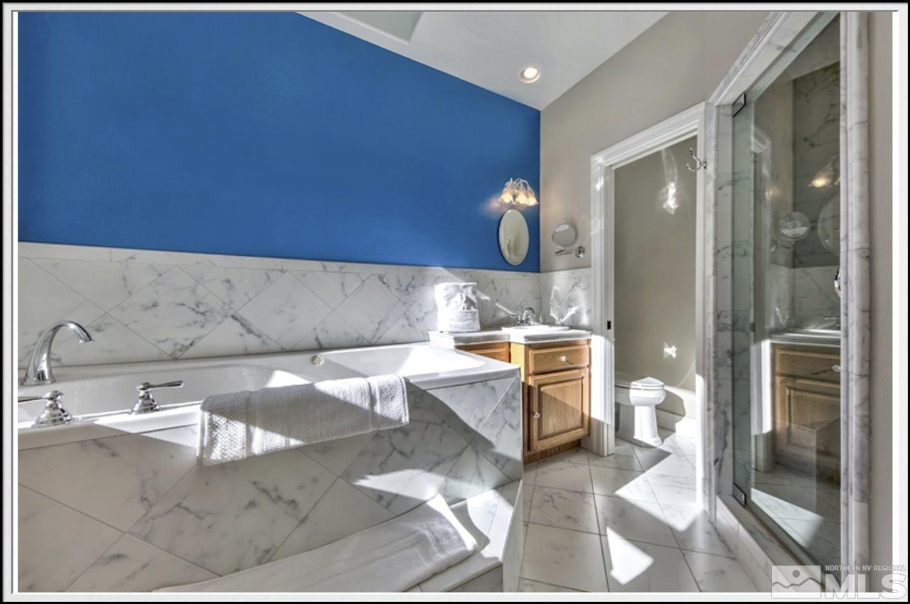 170 Granite Drive Stateline, NV 89449 - Photo 18 of 25 a bathroom with a sink and a mirror