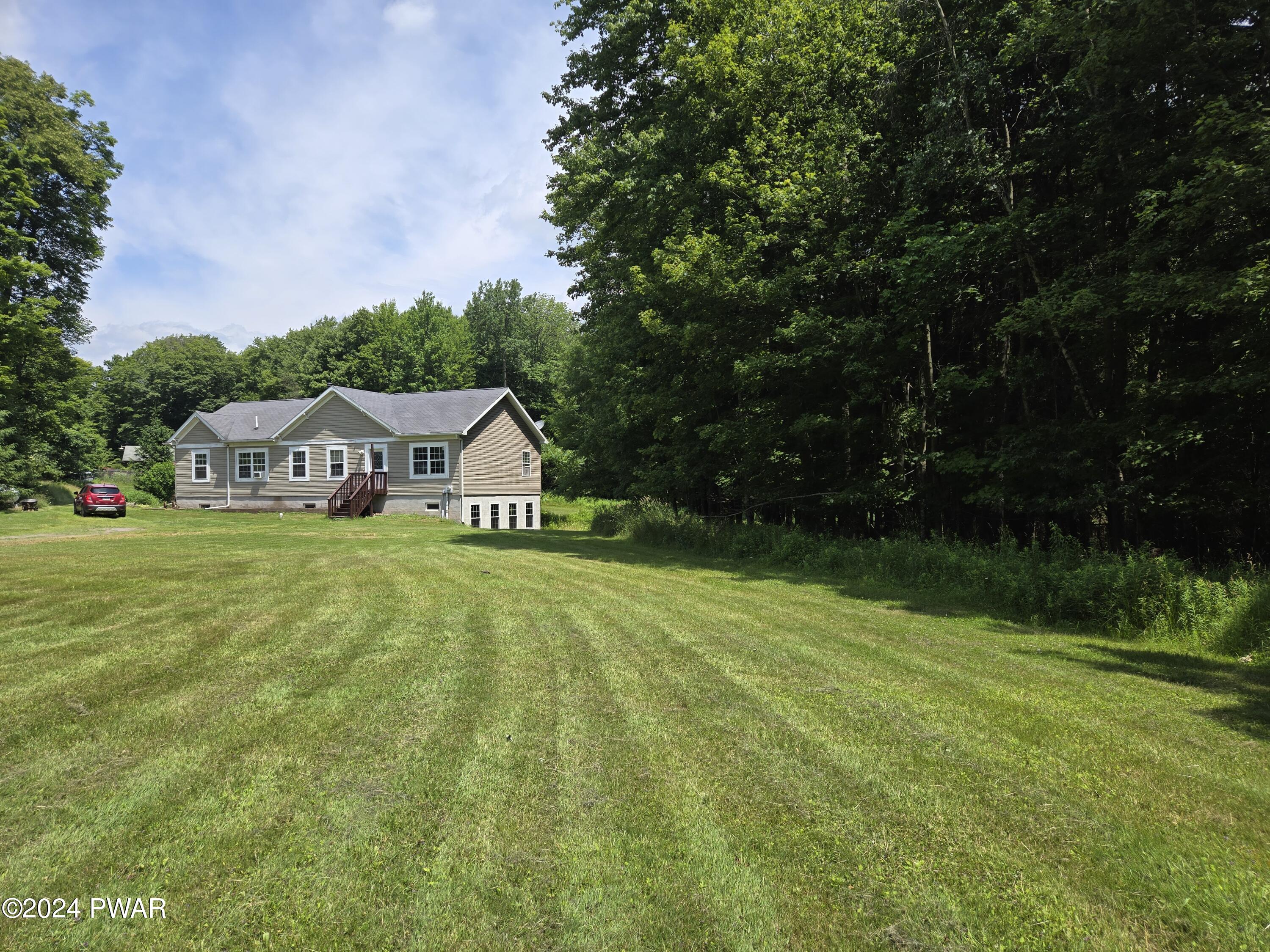 224 Old Racht Road Waymart, PA 18472 - Photo 36 of 39 a front view of a house with garden